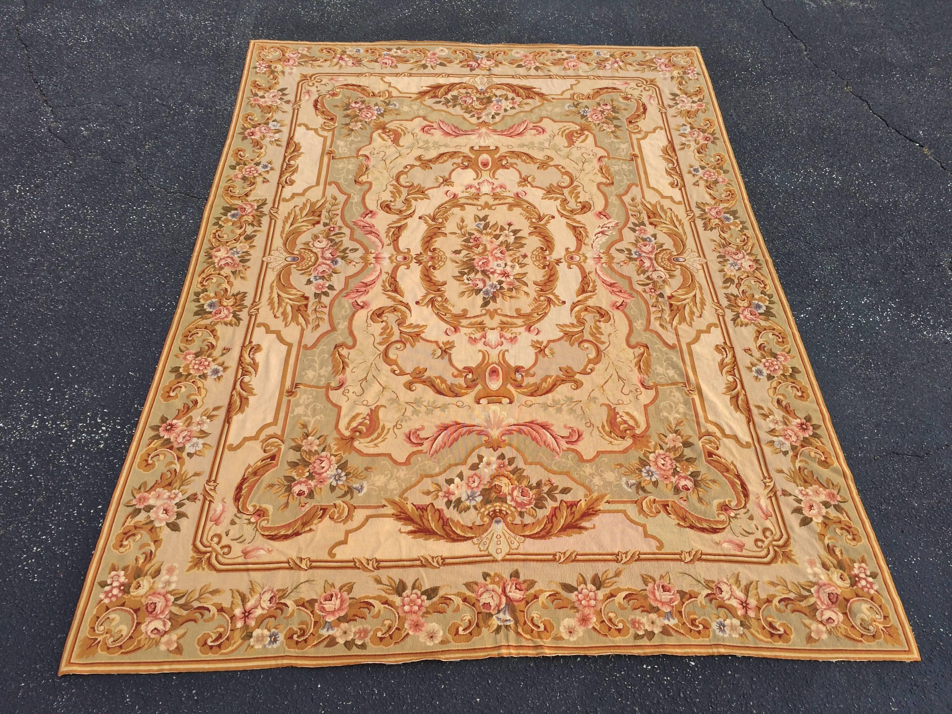 Room Size Aubusson needlepoint rug measure: 9' x 12'. Gold, rust, green and beige tones. 100% wool. Exact measurements: 103 1/2
