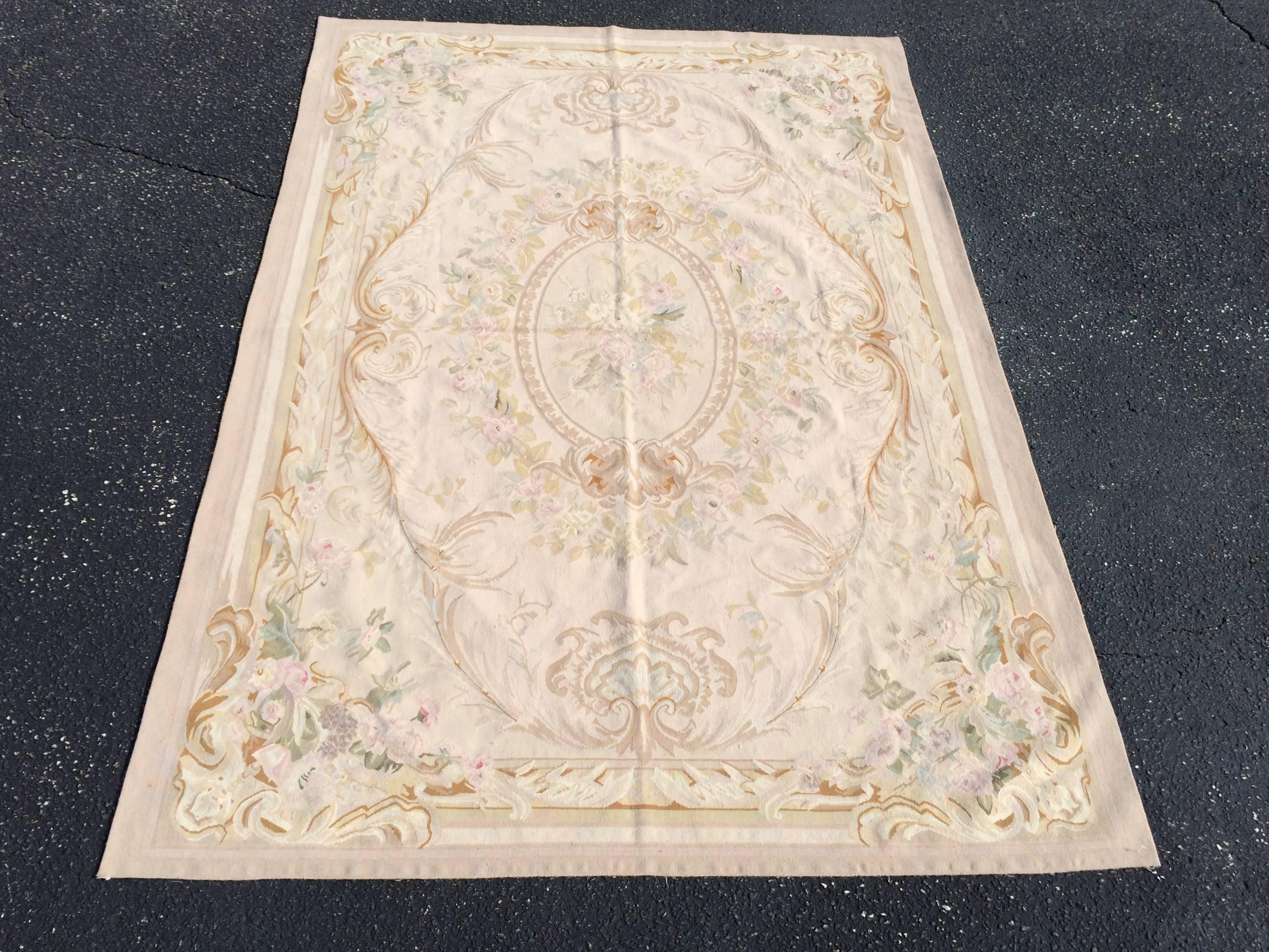 Pale tone Aubusson rug. Rug new with tags. Measures: 6' x 9'. Unused condition. Pale tones include cream, sage green, pink, light brown, beige and lavender .