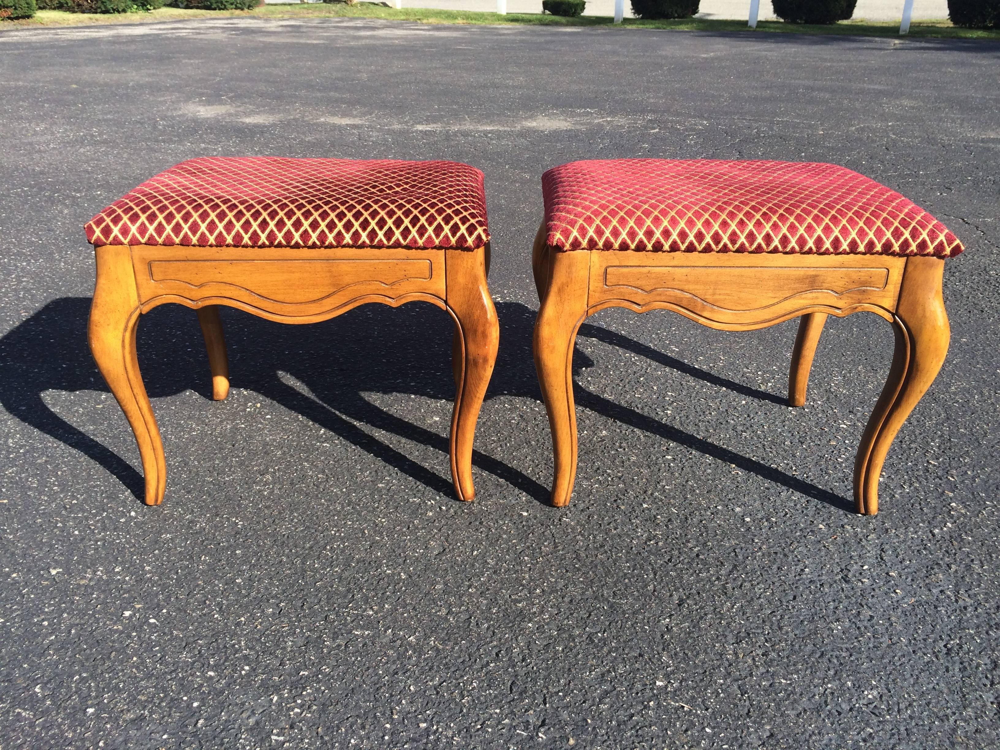 Pair of Ethan Allen stools. Upholstered top and scalloped wooden bottom. Great for underneath a wooden console table. Easy to recover in a more modern fabric. Most likely maple hardwood . French country style.