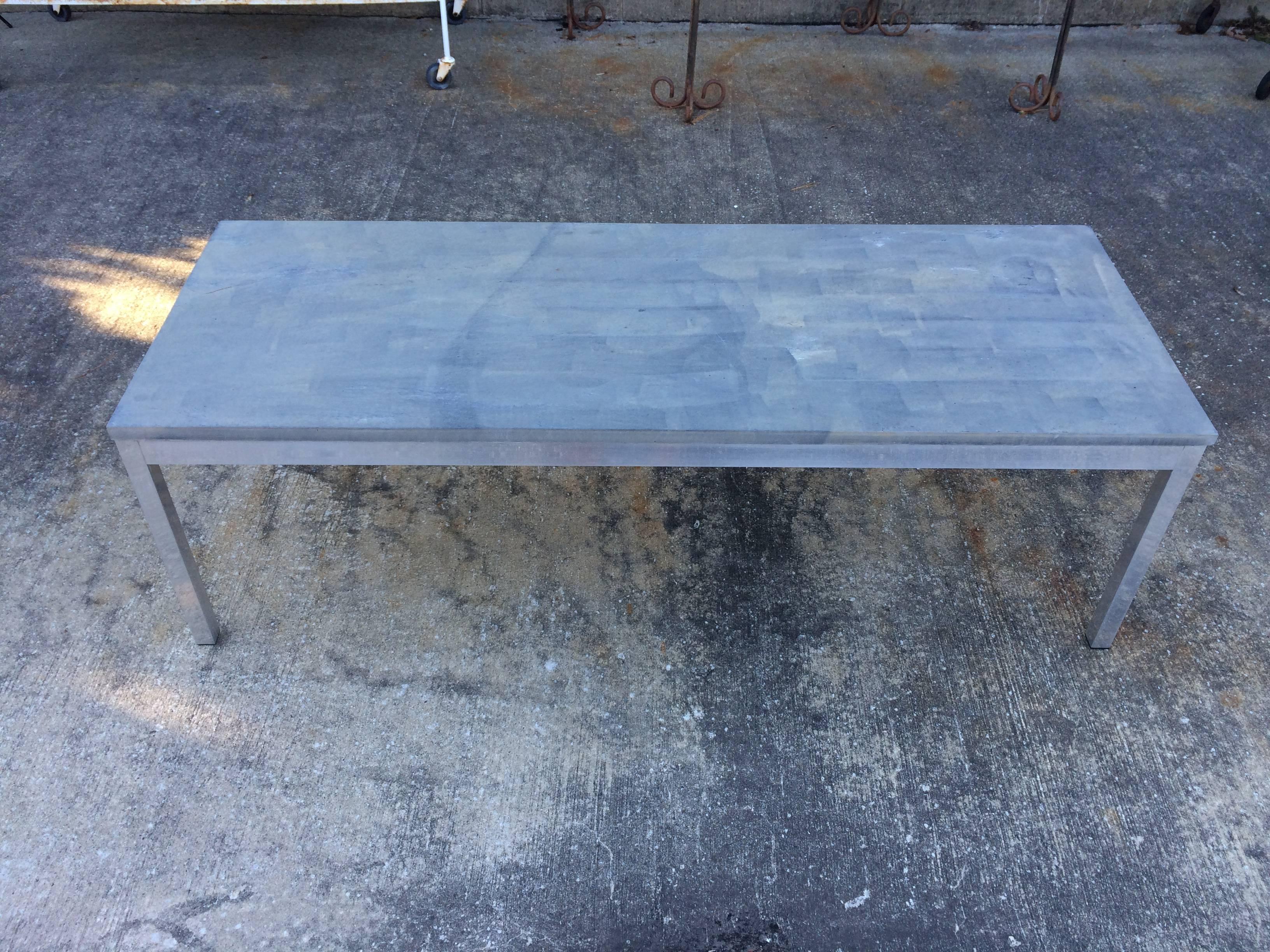 Slate coffee table with aluminum base. Perfect for both in or outdoors. Sleek lines and muted gray tone make up this minimalist table. Perfect for in or outdoor.
Please request updated photos as it has weathered a bit from being outside on our