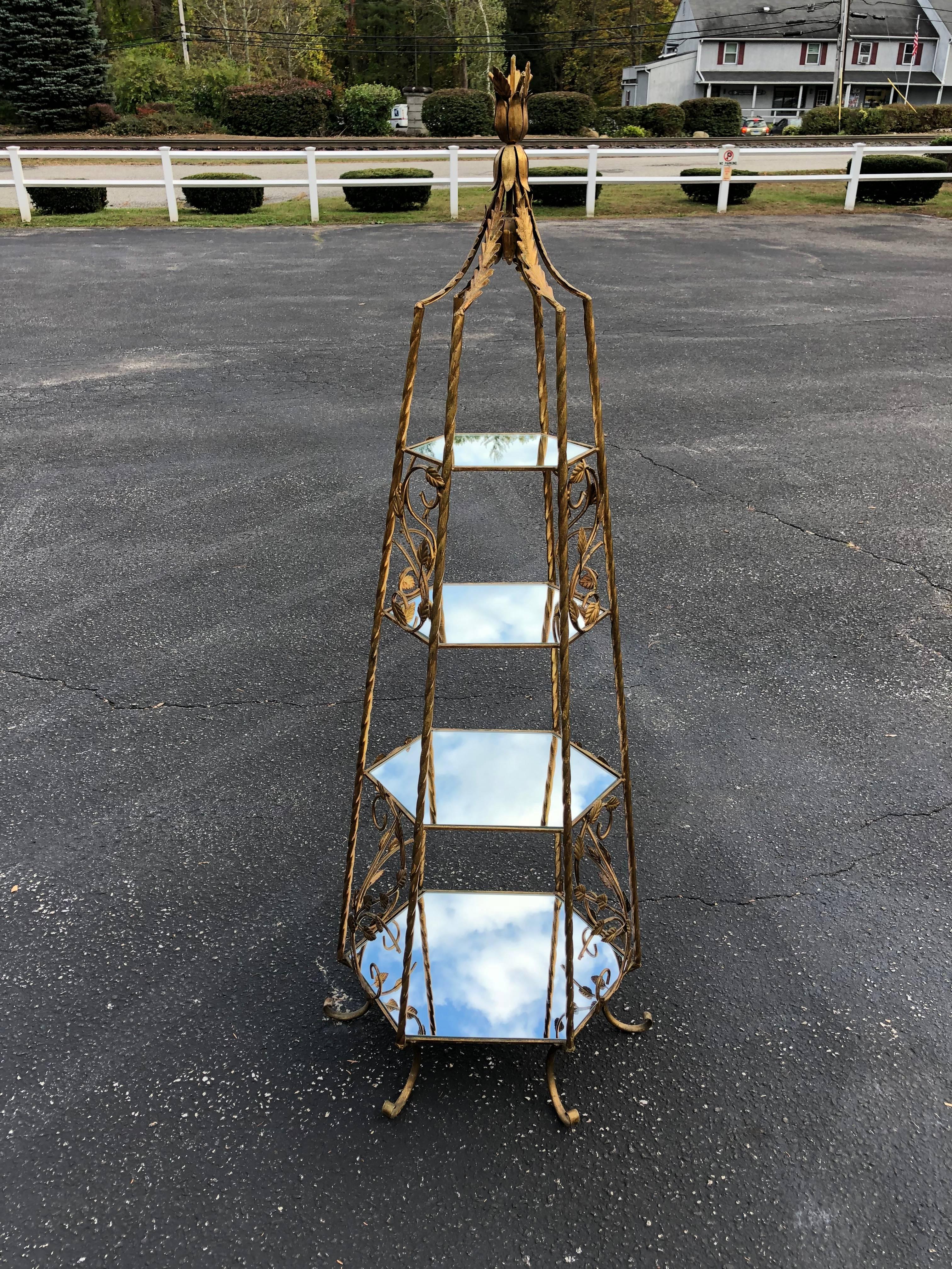 Italianate Gilded Etagere with Mirrored Shelves. This gorgeous piece is perfect for a bathroom or dressing room and even lights up. Use to display perfume or jewelry or photos. Iron stamp , made in Italy.
