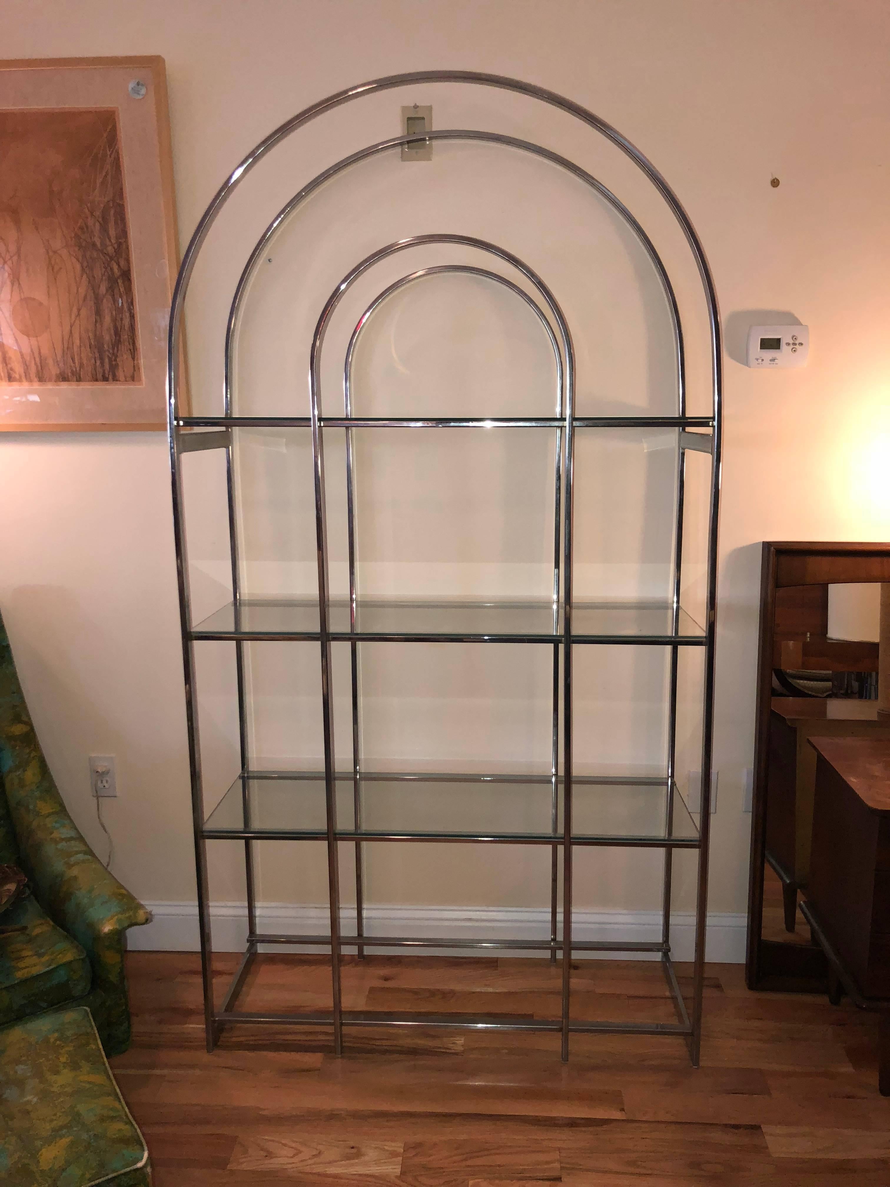 Milo Baughman style chrome étagère with four glass shelves. Great for display piece for living room, office or bedroom. Domed open top makes this very light and airy. Bottom glass shelf is missing in photo but being cut as we list this.
