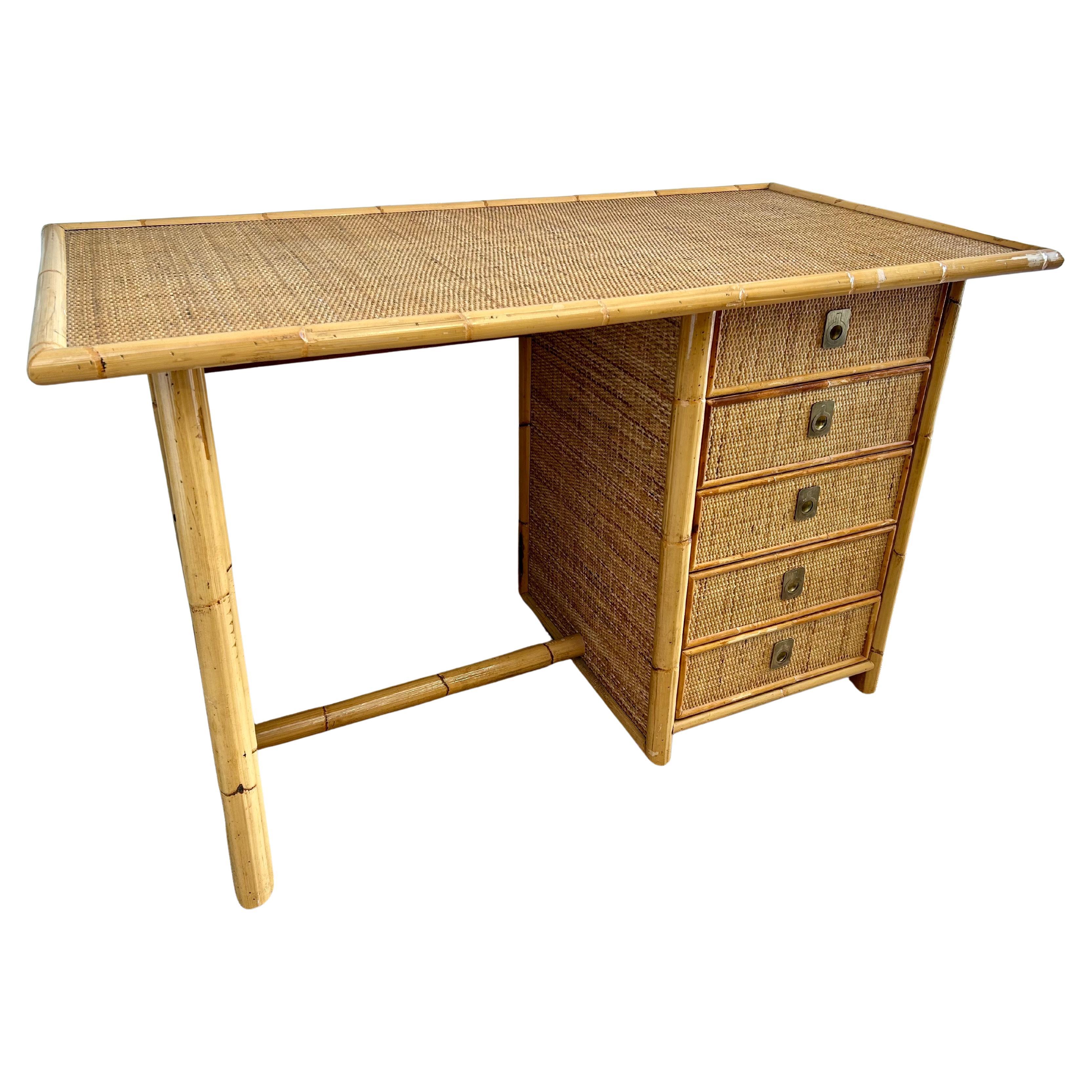 This mid-century modern bamboo and wicker bureau adds a touch Italian riviera to any working space!

Handcrafted by the most sought-after Italian design house, Dal Vera, this writing desk features a bamboo frame and foot rest as well as five side