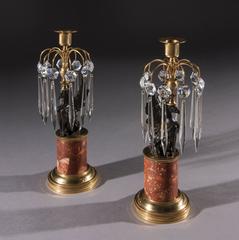Pair of Early 19th Century Gilt-Brass Candlesticks with Bronzed Griffins on Drum
