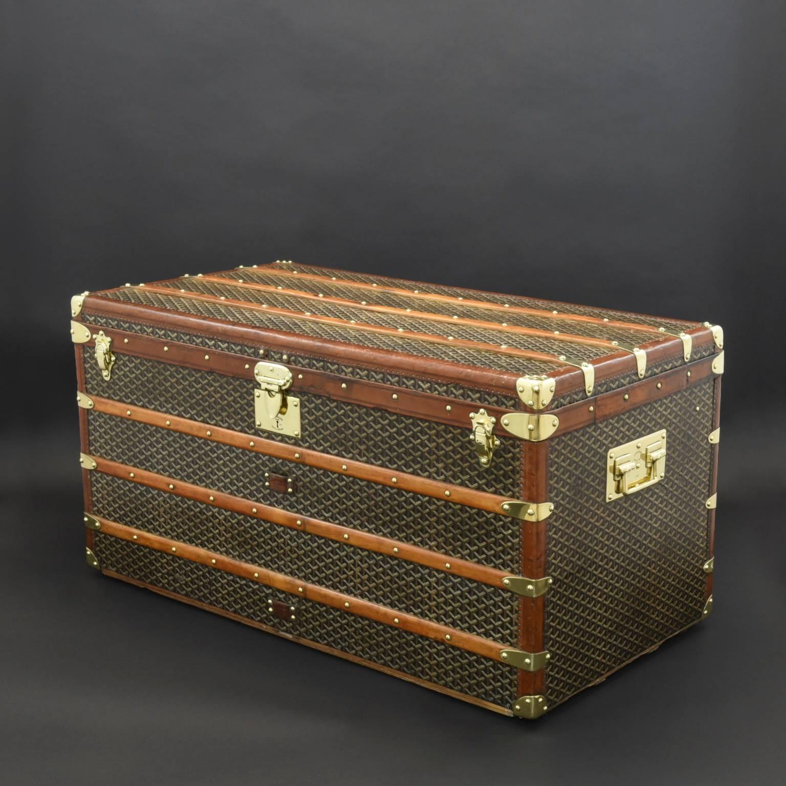 A splendid large size steamer trunk by Goyard with chevron pattern canvas covering, leather trim, and polished brass handles, lock & catches; circa 1909. The interior has been re-lined and some of the leather trim to the exterior repaired