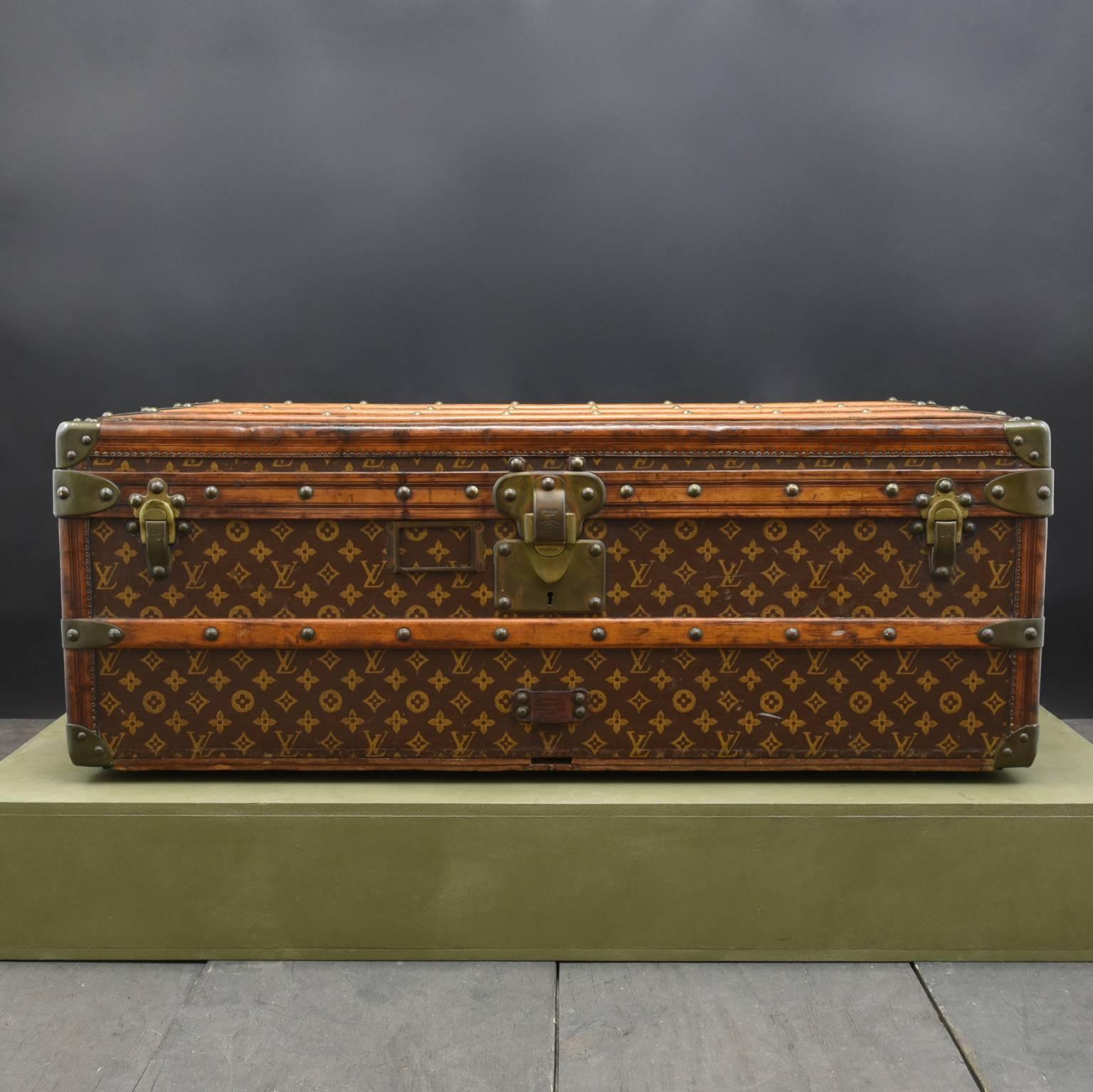 A Louis Vuitton LV Monogram Cabin Trunk c1905 in exceptional original condition. This lovely cabin trunk with leather trim, un-polished patinated brass handles and fittings and original interior with original tray. This trunk is in superb condition