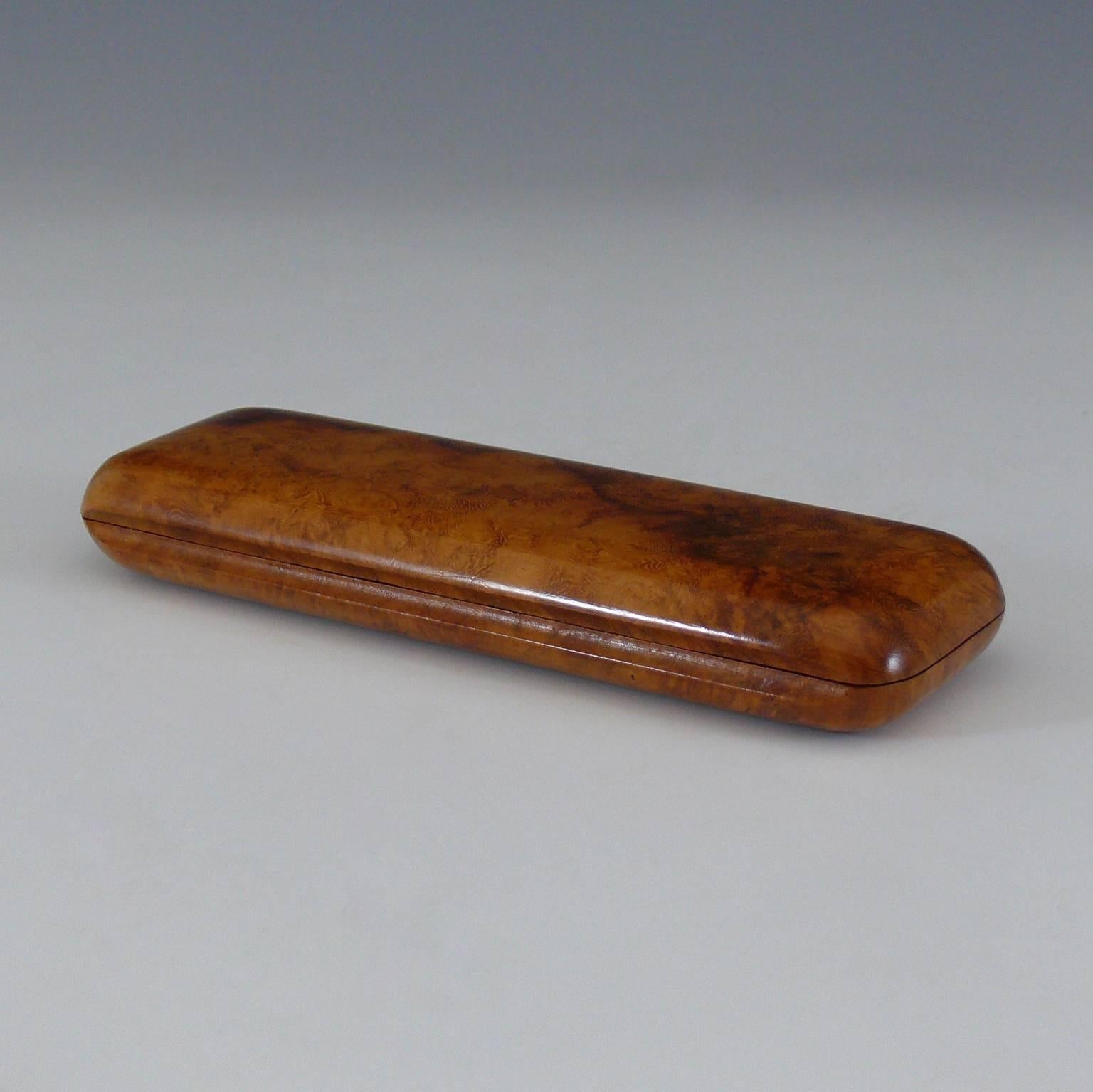 Fabulous wooden cigar case, circa 1910, made from carved Karelian birch wood. Originating from the forests north east of St Petersburg, this wood was used by Faberge amongst others, who chose it for its beautiful figuring. Karelian Birch is not a