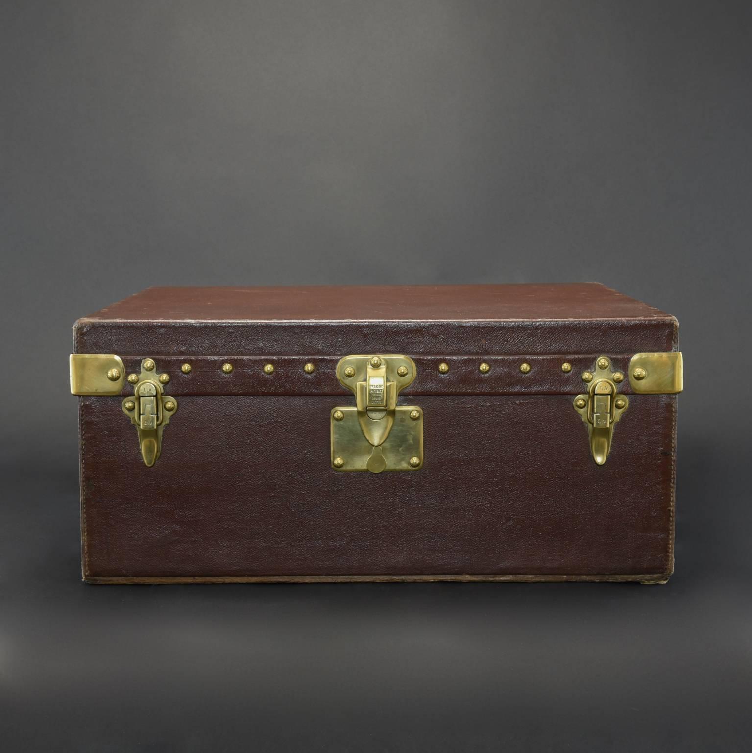 Rare Louis Vuitton motor case in tobacco Vuittonite with brass fittings and original cotton lining to the interior; circa 1905. Parts of the brown Vuittonite canvas have lifted on the left hand side of the case but although worn in places it remains