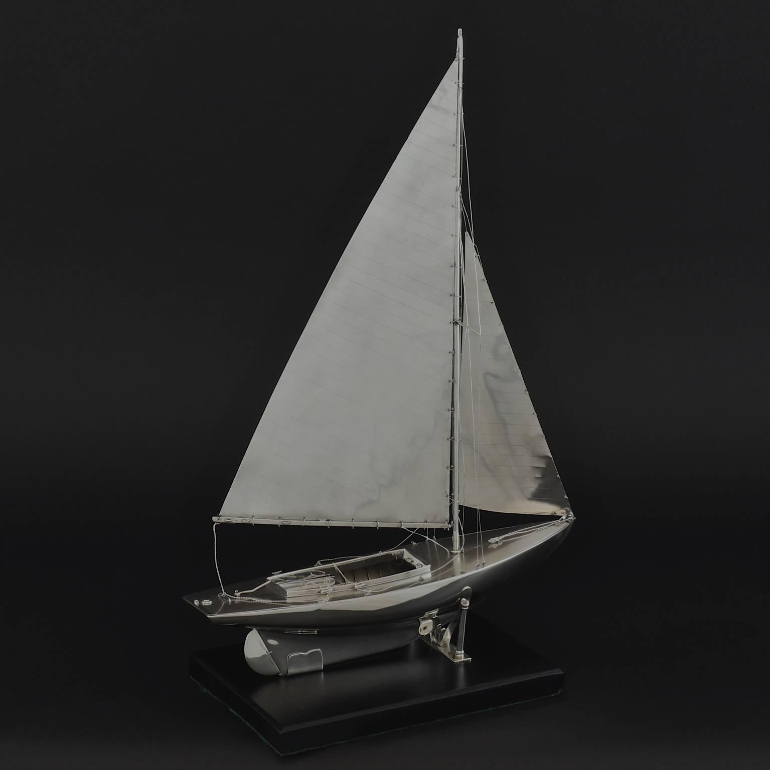 An exceptional, scale model of a Mylne O.D. class yacht made in Sterling silver, hall marked 1935. Beautifully detailed, it even has Sterling silver rigging and sails!

Benzie of Cowes was established in 1862 by the late Mr. Simpson Benzie. Through