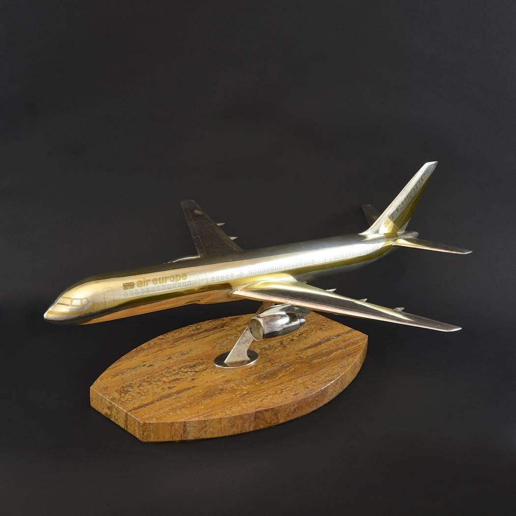 Exceptionally rare hallmarked silver Boeing 757–200 jet aircraft model; London 1984. With makers mark for Garrard and Co., who at the time, were the Crown Jewellers. In Air Europe livery with gilded and engraved details, the plane has been lacquered