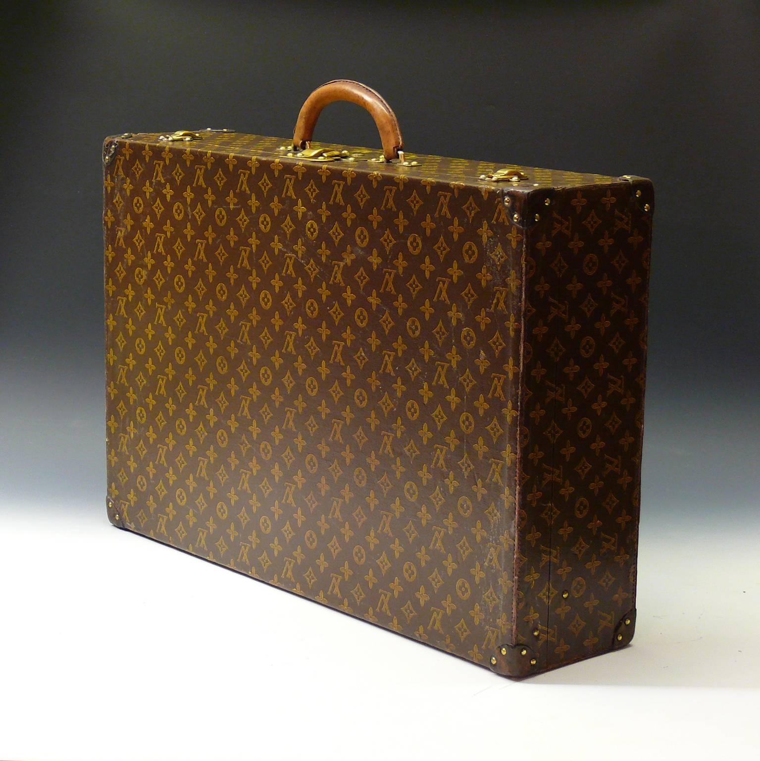 An unusual and lightweight vintage Louis Vuitton suitcase in LV monogram with leather corners and original interior, circa 1945.

Louis Vuitton was founded by its namesake in 1854, with the first shop on Rue Neuve des Capucines in Paris, France.