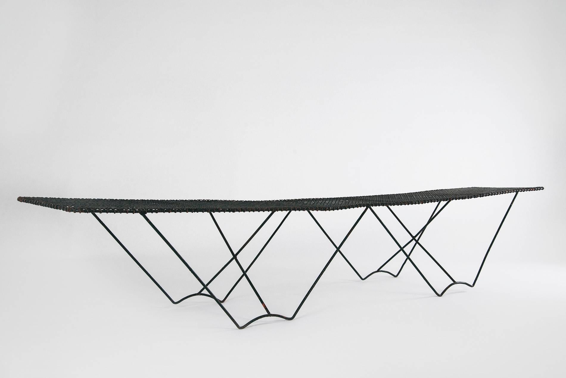 Exquisitely graphical bench or low table manufactured in Italy in the 1950s. Black lacquered metal feet, wire mesh top. Beautiful patina.
