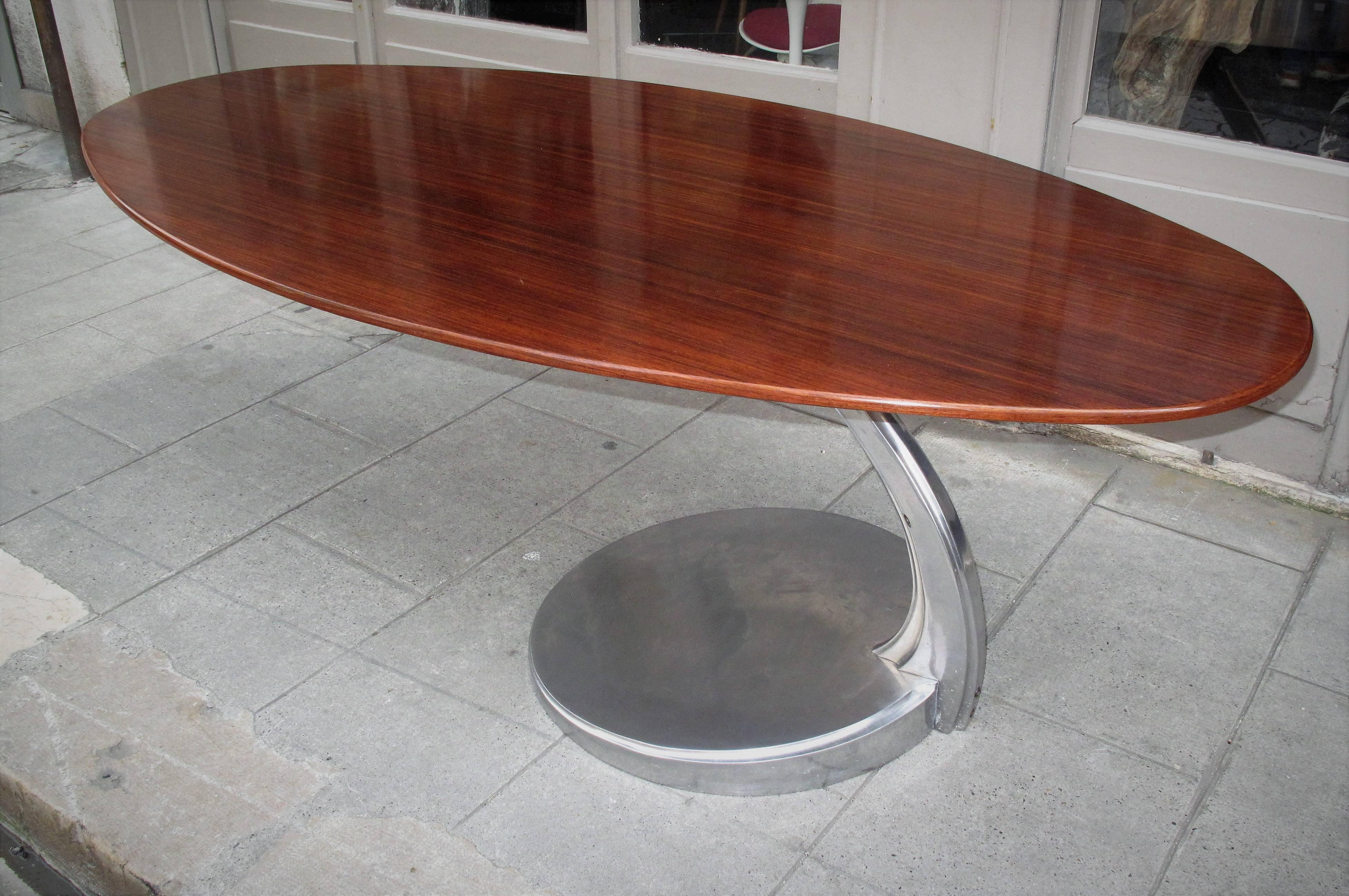 Michele Charron rosewood and aluminium table, circa 1960
Solid cast aluminium cantilevered base with oval rosewood top. Marked Charron Paris, France.