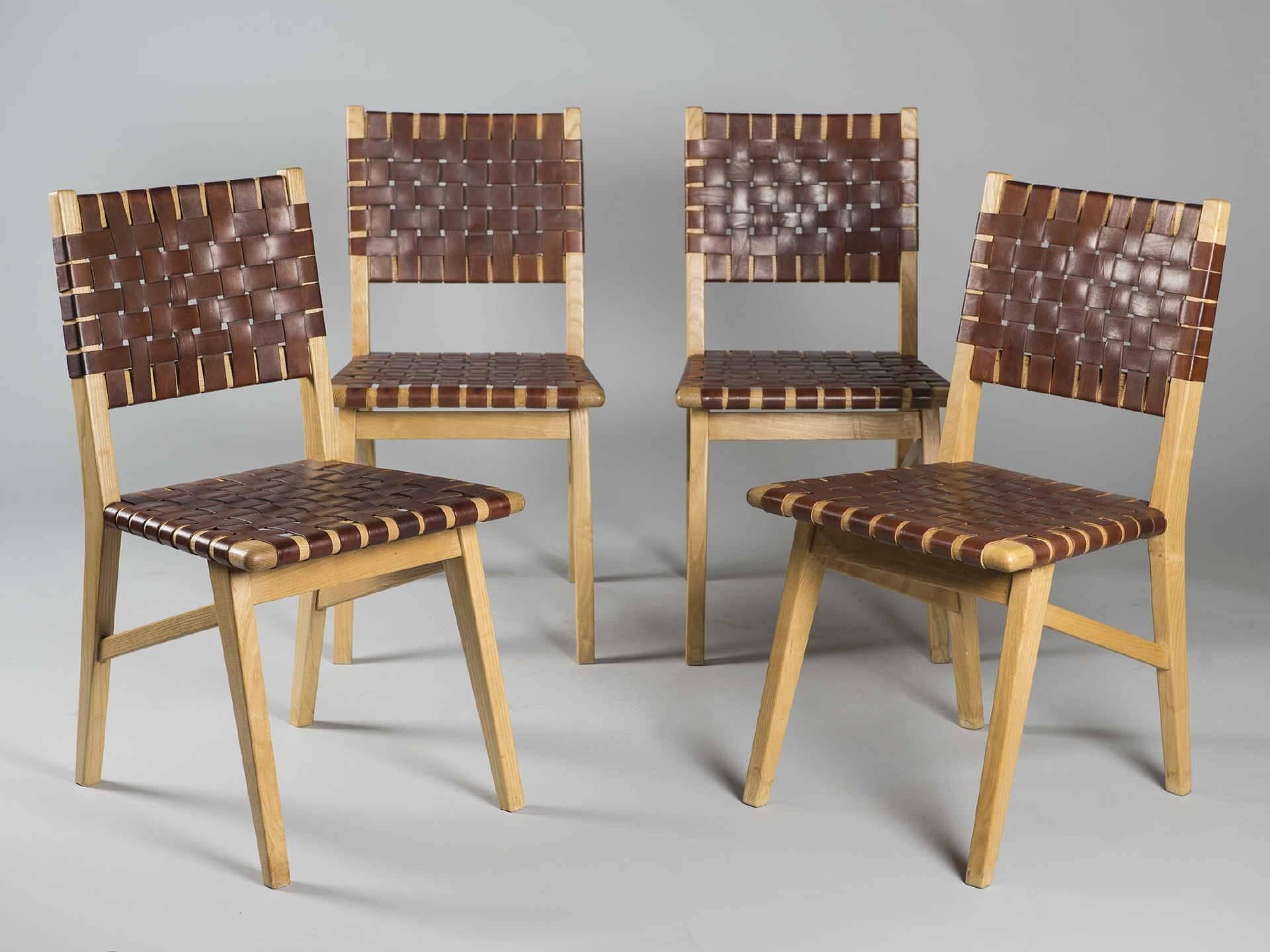 Set of four side chairs by Jacques Adnet - 'Compagnie des Arts Francais' leather and ash tree. Circa 1940.