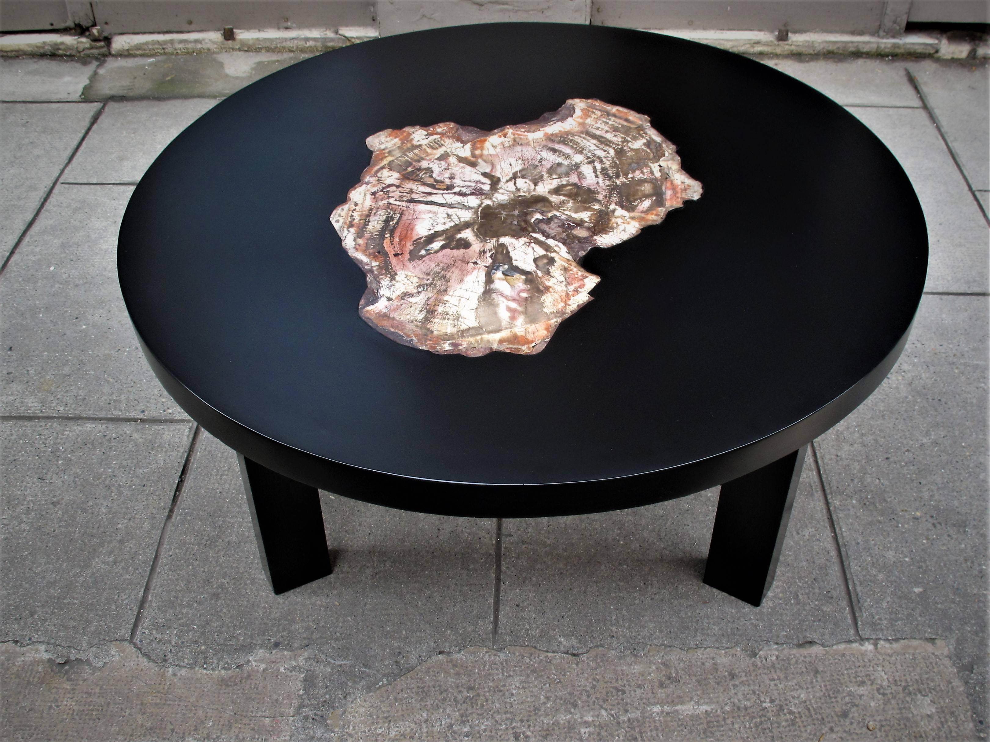 Tabletop in resin with petrified wood in the style of Ado Chale.
 