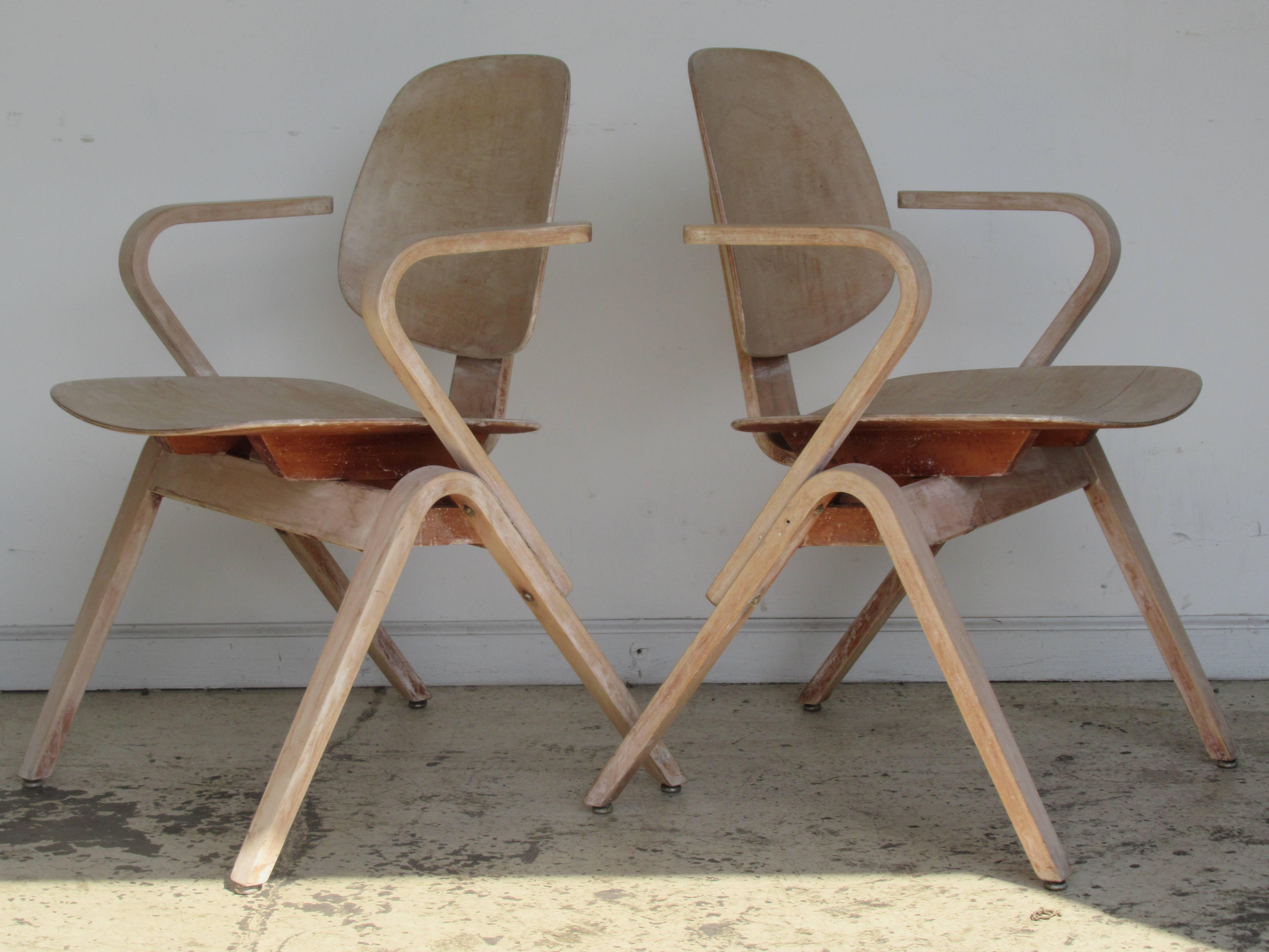 Great looking pair of bent plywood streamlined modernist armchairs designed by Joe Atkinson for Thonet in a stripped and bleached surface color. Circa 1950. Look at all pictures and read condition report in comment section.