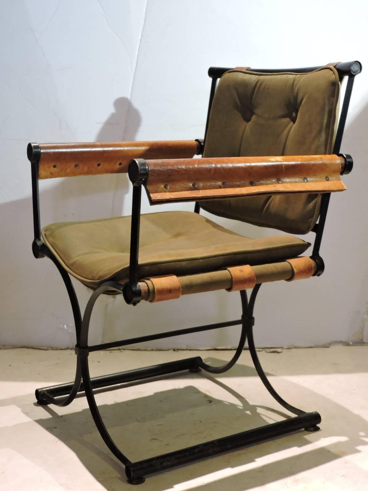 California modernist campaign chair designed by Cleo Baldon for Inca Products - Santa Fe Springs, Ca. All original vintage iron and leather riveted with olive green suede upholstery with beautifully aged patina color - circa 1960s.