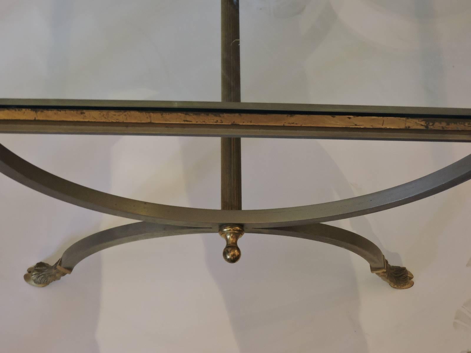 A pair of exceptional quality steel and gilt brass decorated side tables with finely detailed hoof feet and beautifully aged old surface and patina color to metal ware, circa 1960-1970 in the style of Maison Jansen.