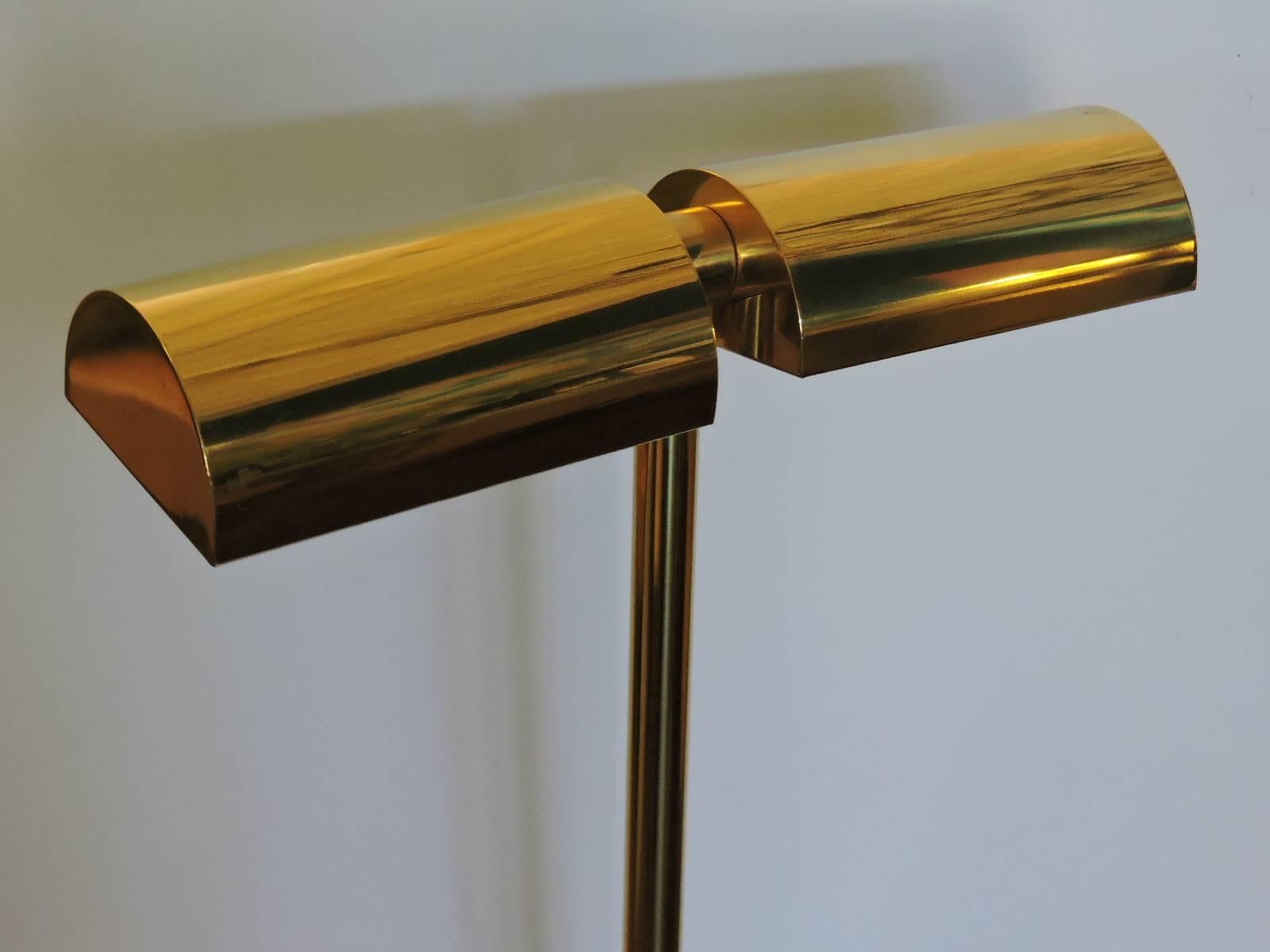 A good looking golden brass adjustable position pharmacy style double cylinder shade floor lamp by George Kovacs - circa 1970s. Look at all pictures and read condition report in comment section.