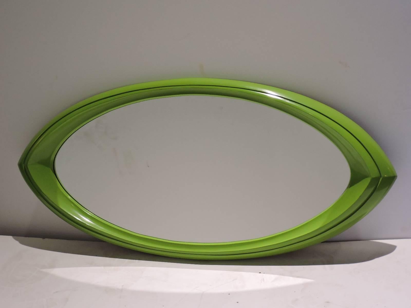 An eye dazzling lime green contoured oval pop art wall mirror dating from the 1970's in the style of Verner Panton. Presently wired for vertical hanging - can also be wired for horizontal. Look at all pictures and read condition report in comment