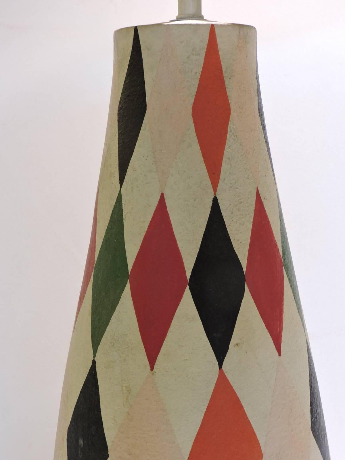 A polychrome painted large scale plaster table lamp with an all over harlequin like diamond design. Circa 1950. This one is a show stopper. Look at all pictures and read condition report in comment section