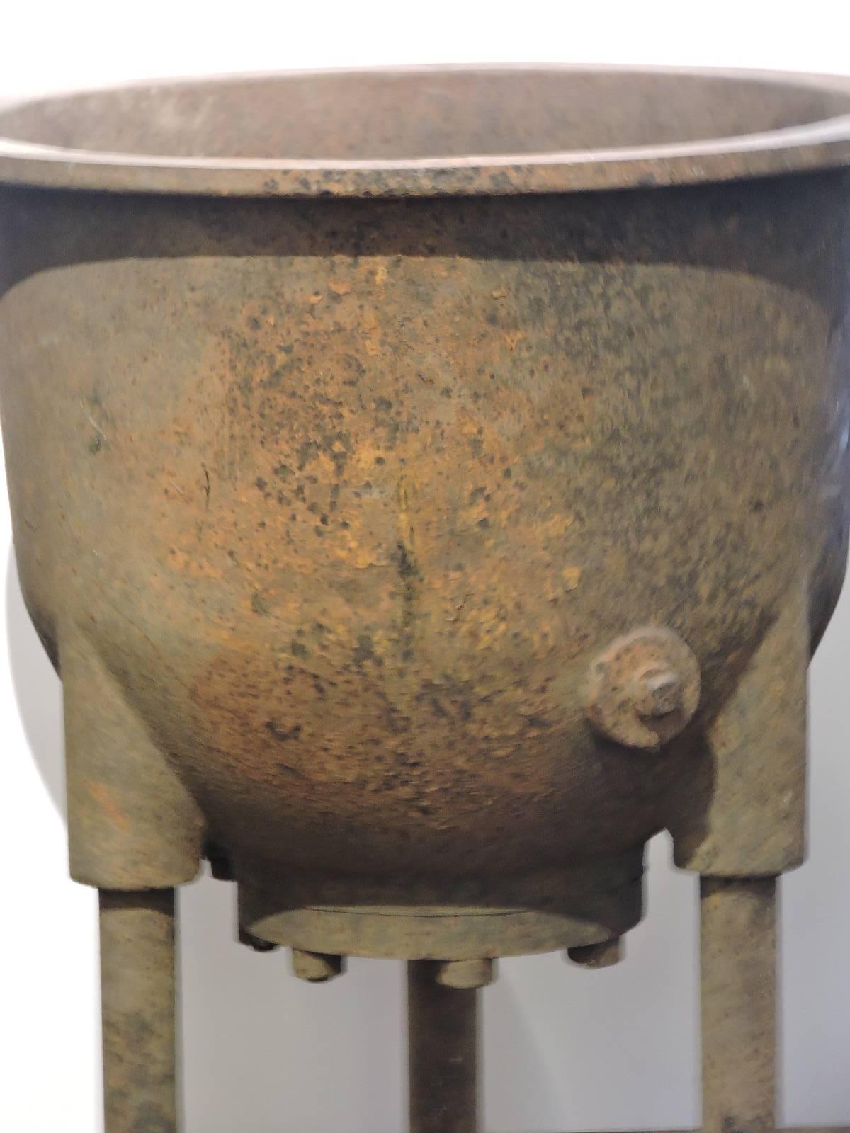 Large and heavy cast iron Industrial factory cauldron raised on three tall footed legs. Manufactured by Sowers - Buffalo, NY (see pictures of copper plate - image numbers 7, 8 and 9). This dates from the early 1900s. There are three available - this