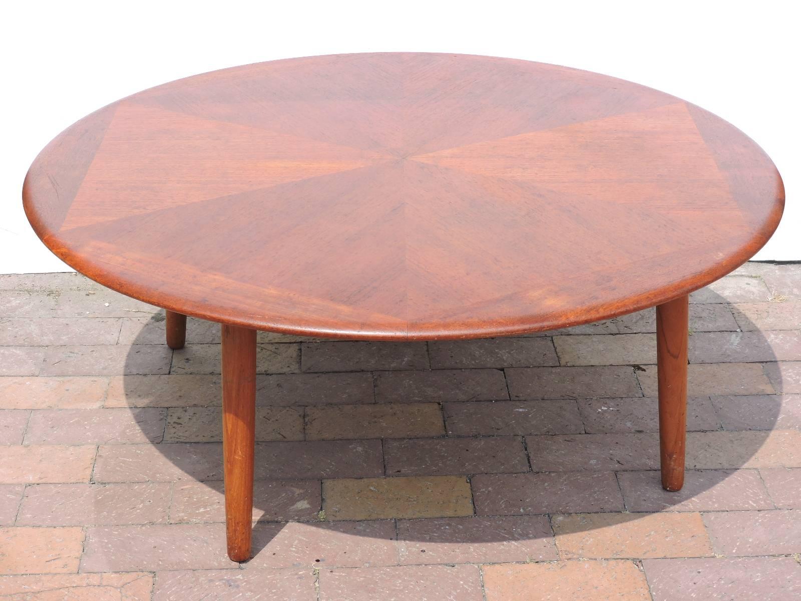 A round four-legged coffee table with a three-tone solid teak diamond design top by H. W. Klein for Bramin, Denmark, 1960s.