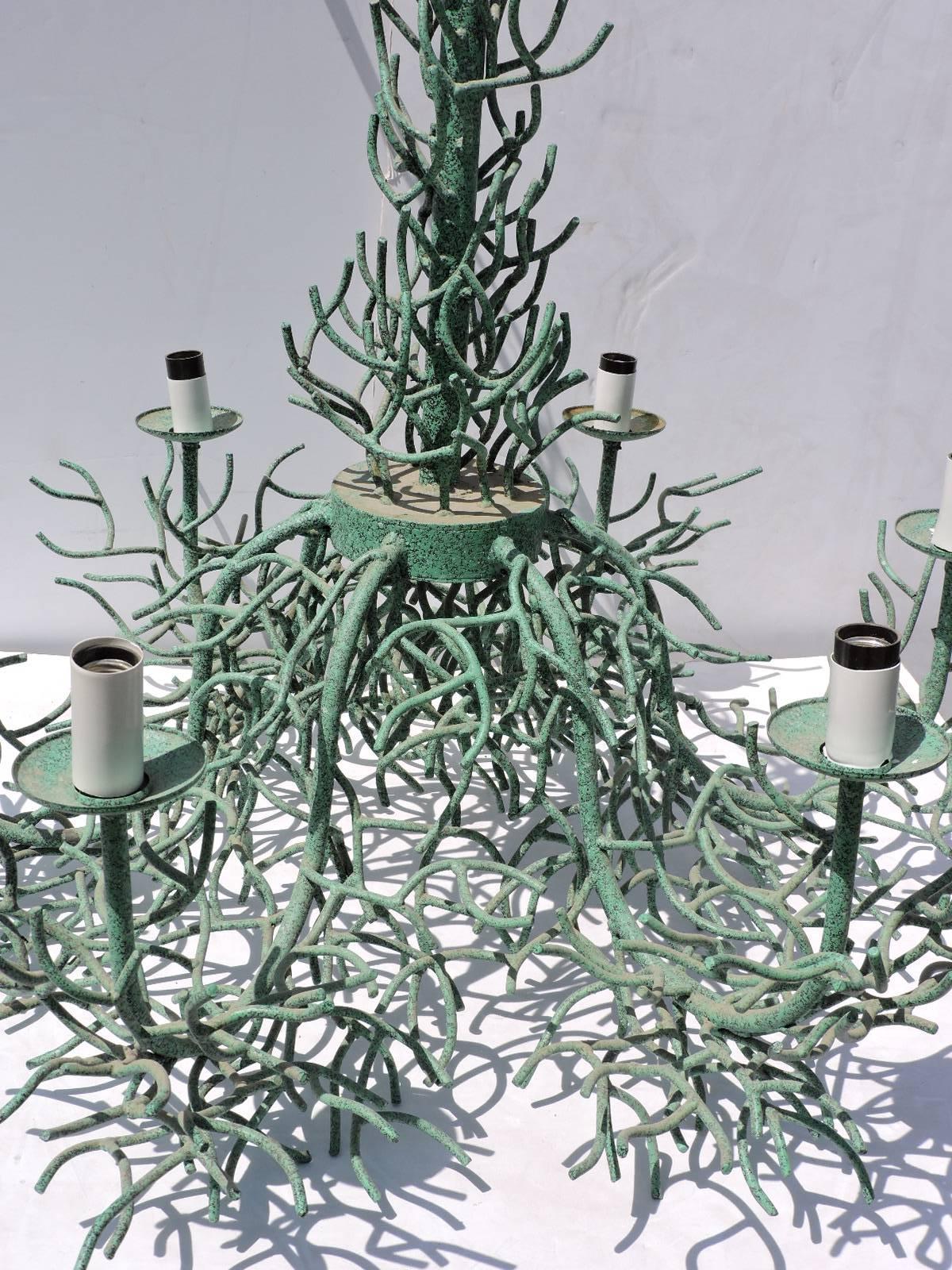 Dating from the 1970's - a large scale finely hand forged and intricately detailed wrought iron coral chandelier with six candle armatures in all over beautifully aged original faux verdigris textured finish by Arte De Mexico - North Hollywood,