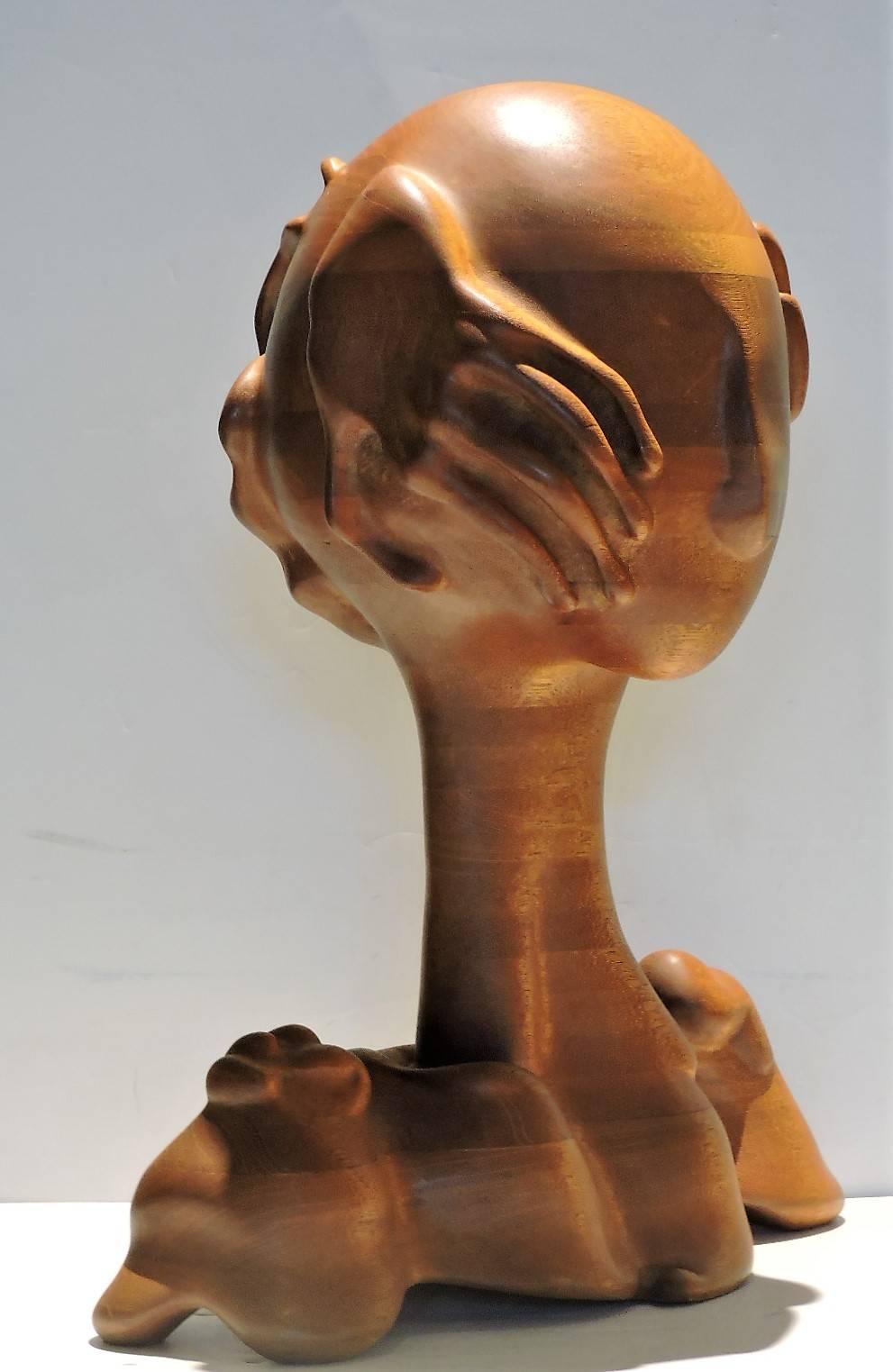 A large stack laminated finely carved mahogany sculpture of head with shoulders and hands in the exotic surrealist manner of Pedro Friedeberg by noteworthy American artist sculptor and founder of the Zenith Gallery in Washington D.C. - Margery
