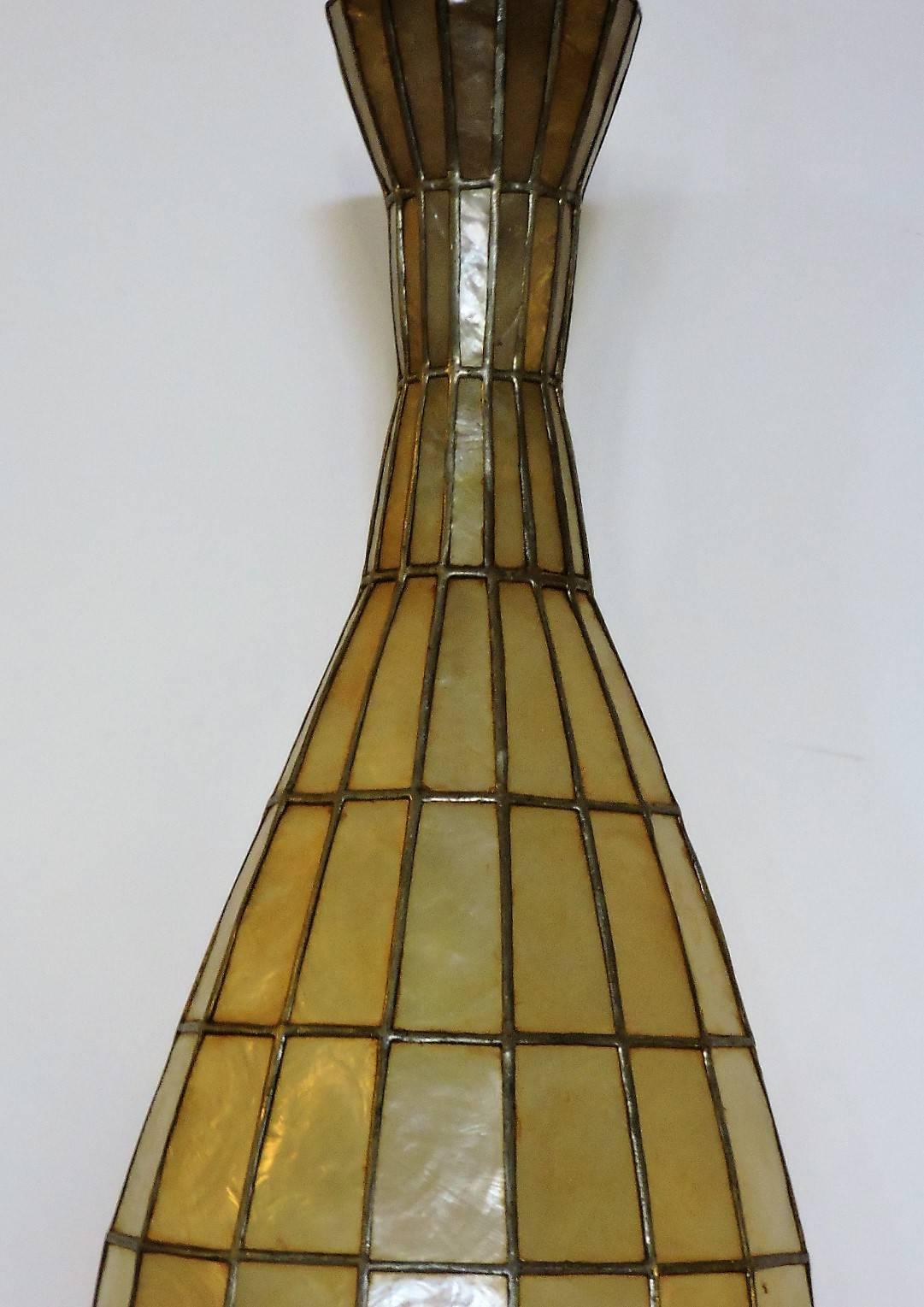 A  large sculptural capiz shell chandelier pendant light with an elongated bottle neck vase shape - circa 1960s.