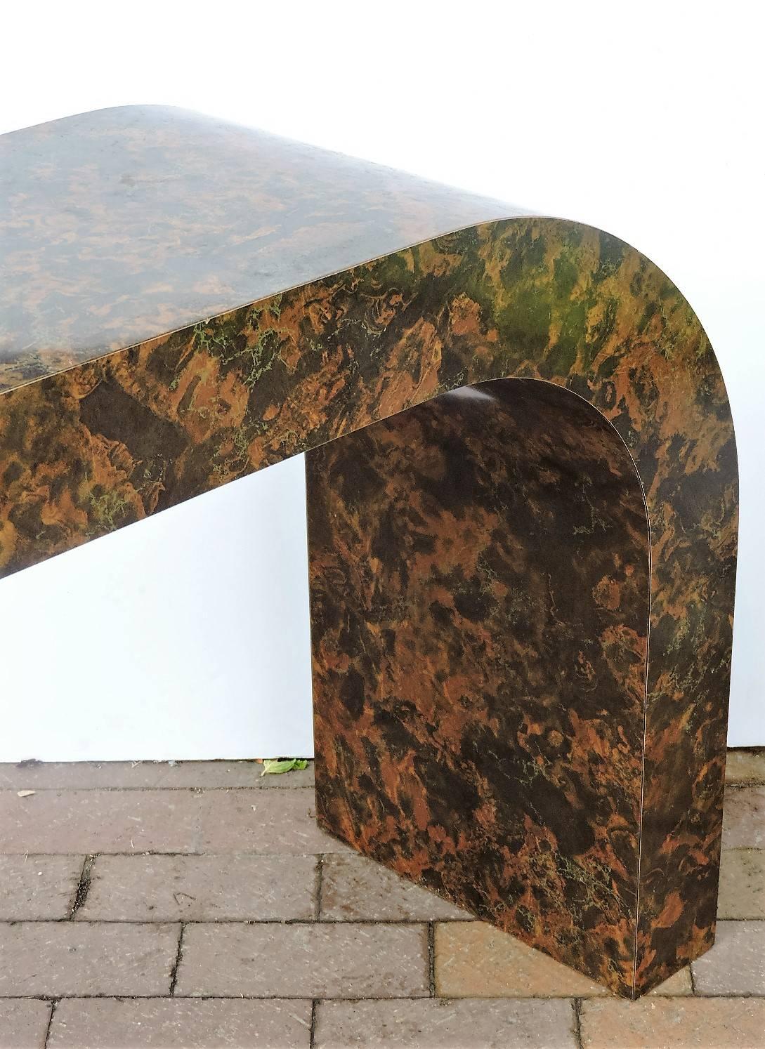 Faux tortoise marbleized laminated parsons waterfall design console table in the style of Karl Springer, circa 1970s. See all pictures