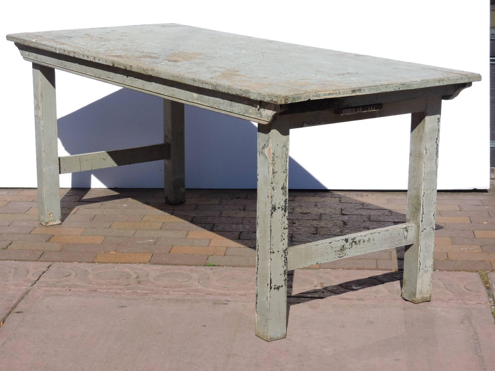 All original antique collapsible folding leg wood dining farm table/work table in aged worn distressed very pale robins egg blue painted surface with a number of small holes to top and some rivet bolts on sides - apparently used for many years as a