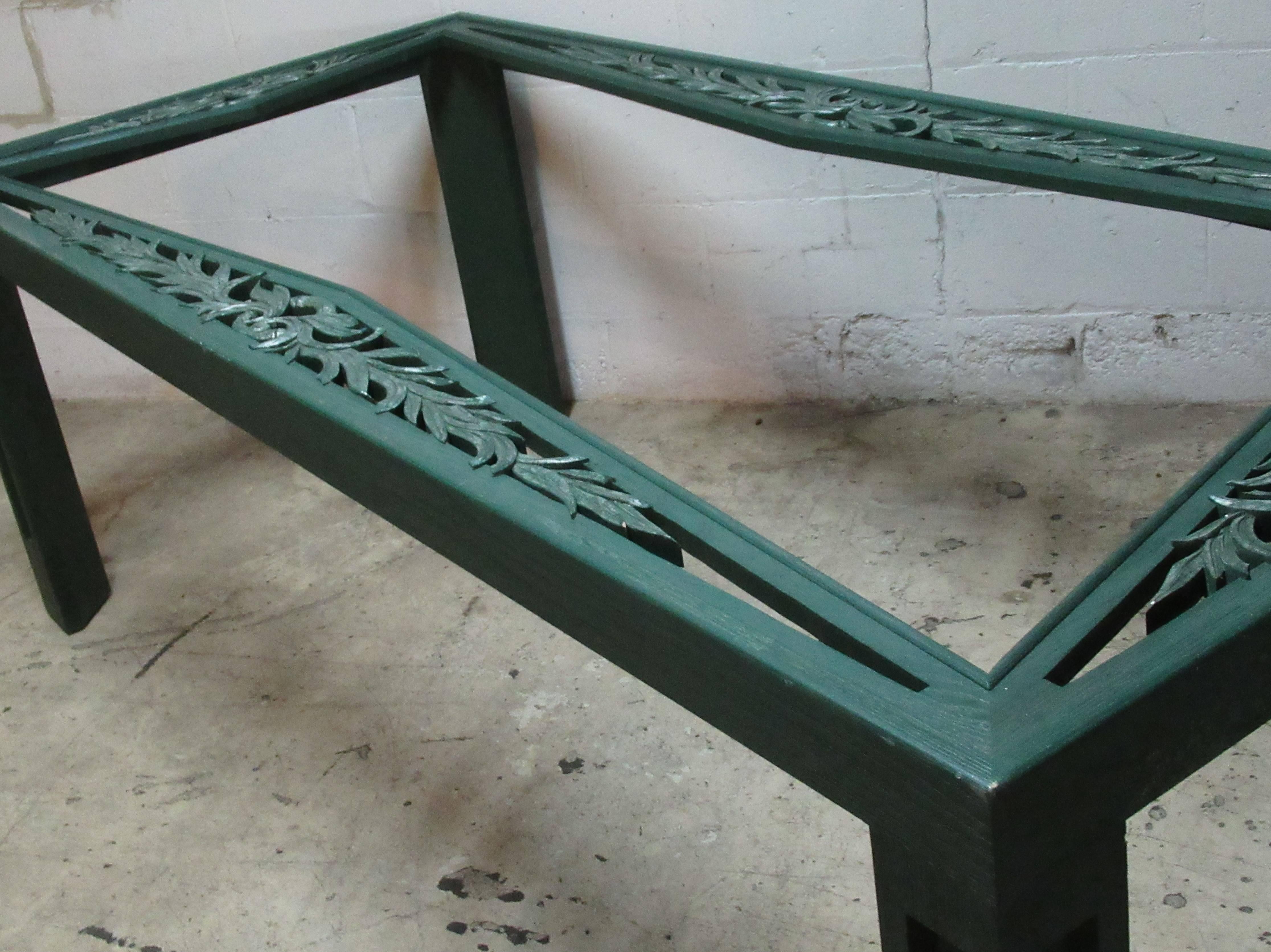 Art Deco style large rectangular dining table by James Mont with carved leaf design perimeter at all four sides of top and deep cut-out design on legs. It is in the original green cerused stain painted and silver leaf like finish. Structurally rock