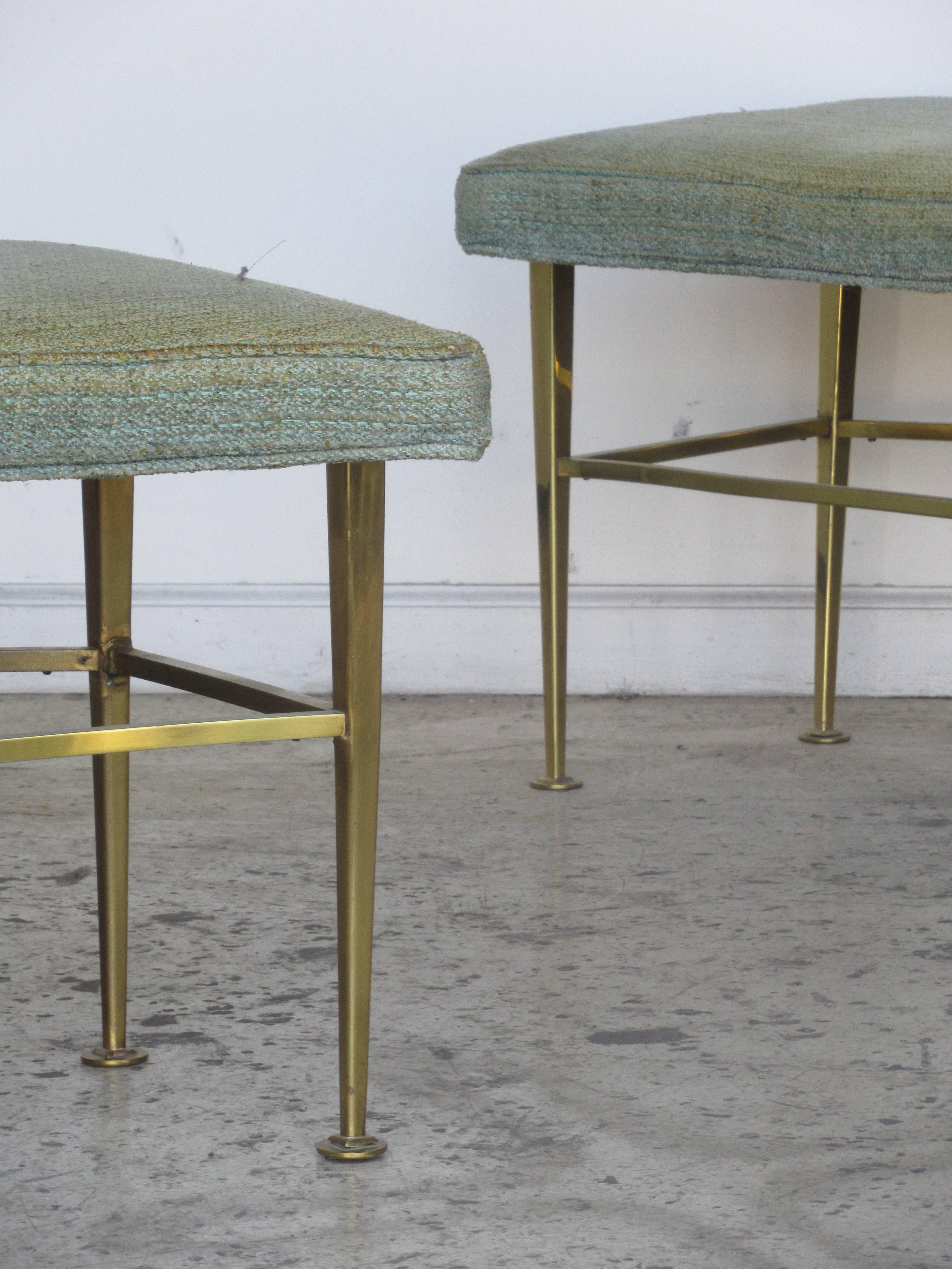 Pair of very sleek modernist brass benches with curved form and original upholstered seats, circa 1950.
