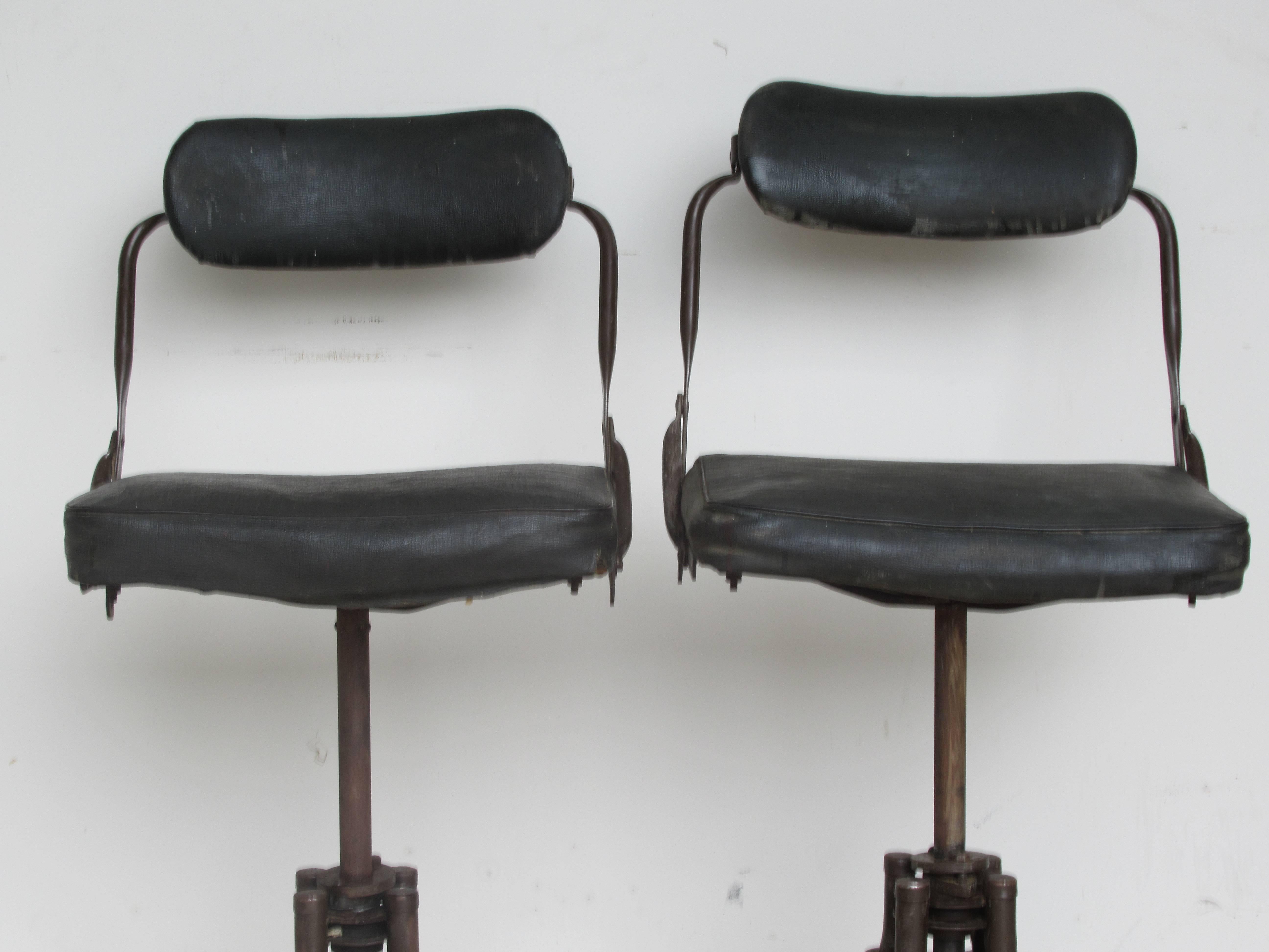 Pair of early all original American Industrial rolling swivel adjustable position task chairs by Do More / Do-More, circa 1930-1940.