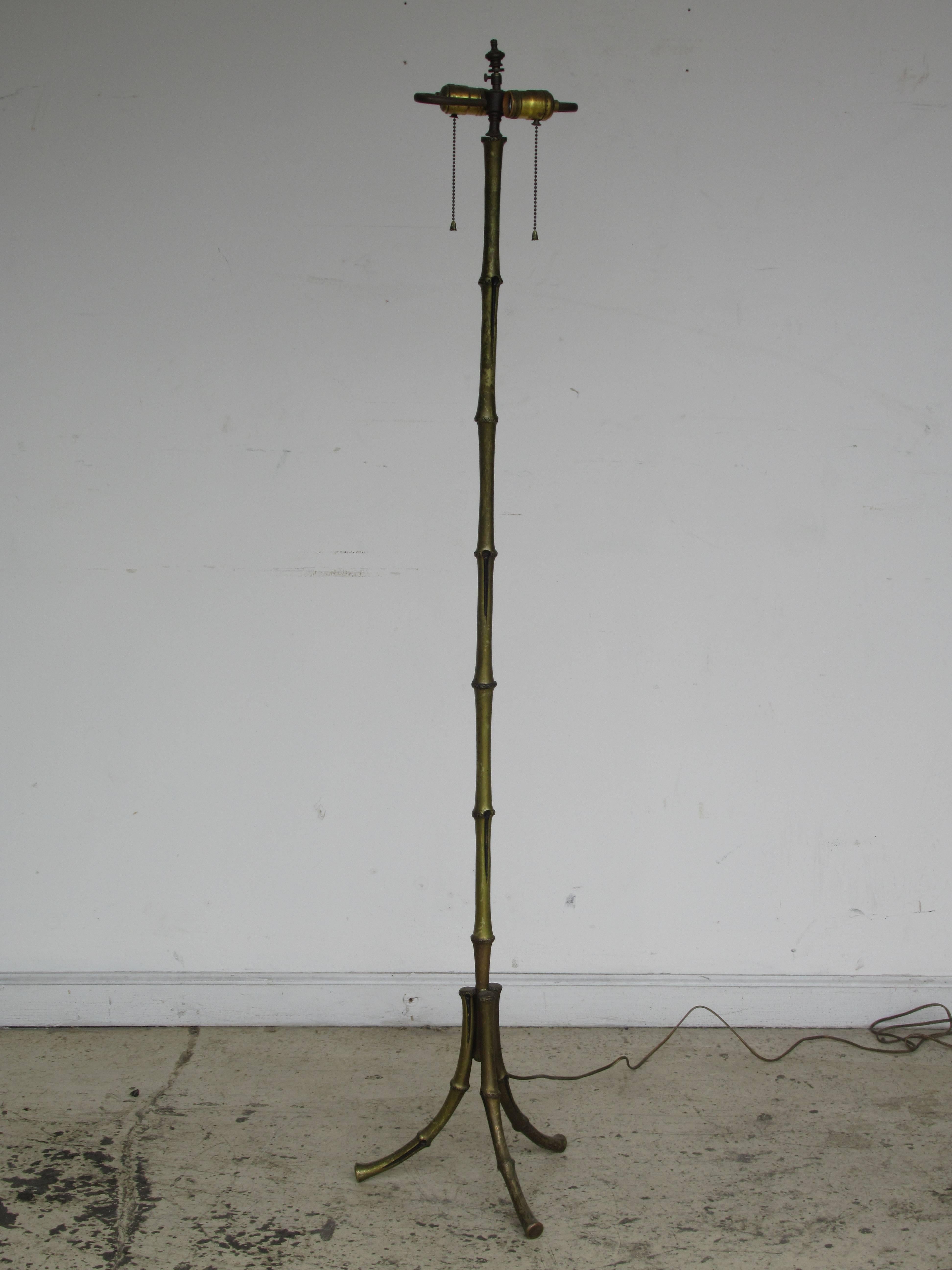 A finely detailed lacquered brass bronze faux bamboo floor lamp with beautifully aged original patina. Style of / or attributed to Maison Bagues / France, circa 1940s.