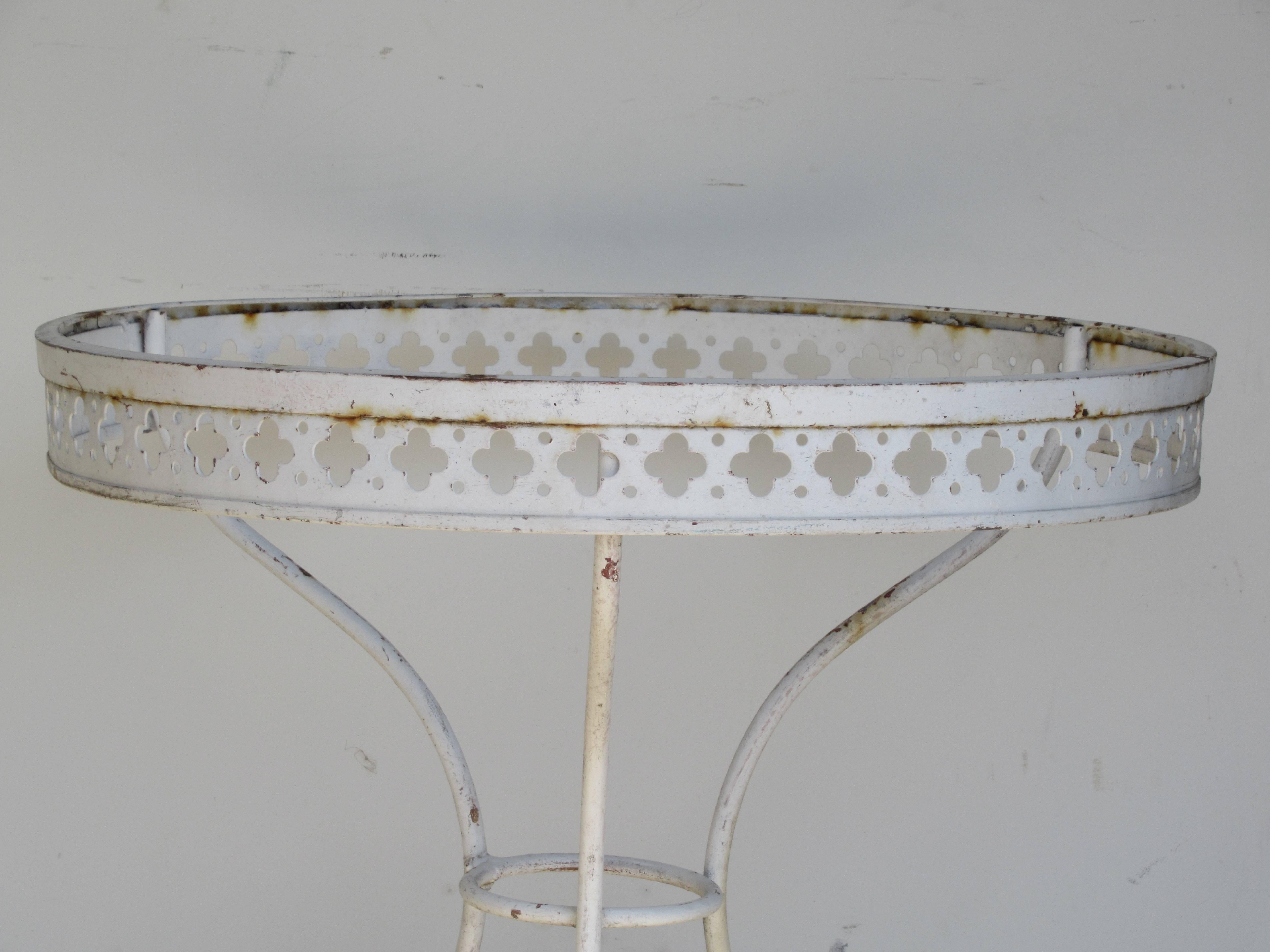 Old white painted wrought iron garden patio bistro dining centre table. Exterior or interior use, circa 1960s.