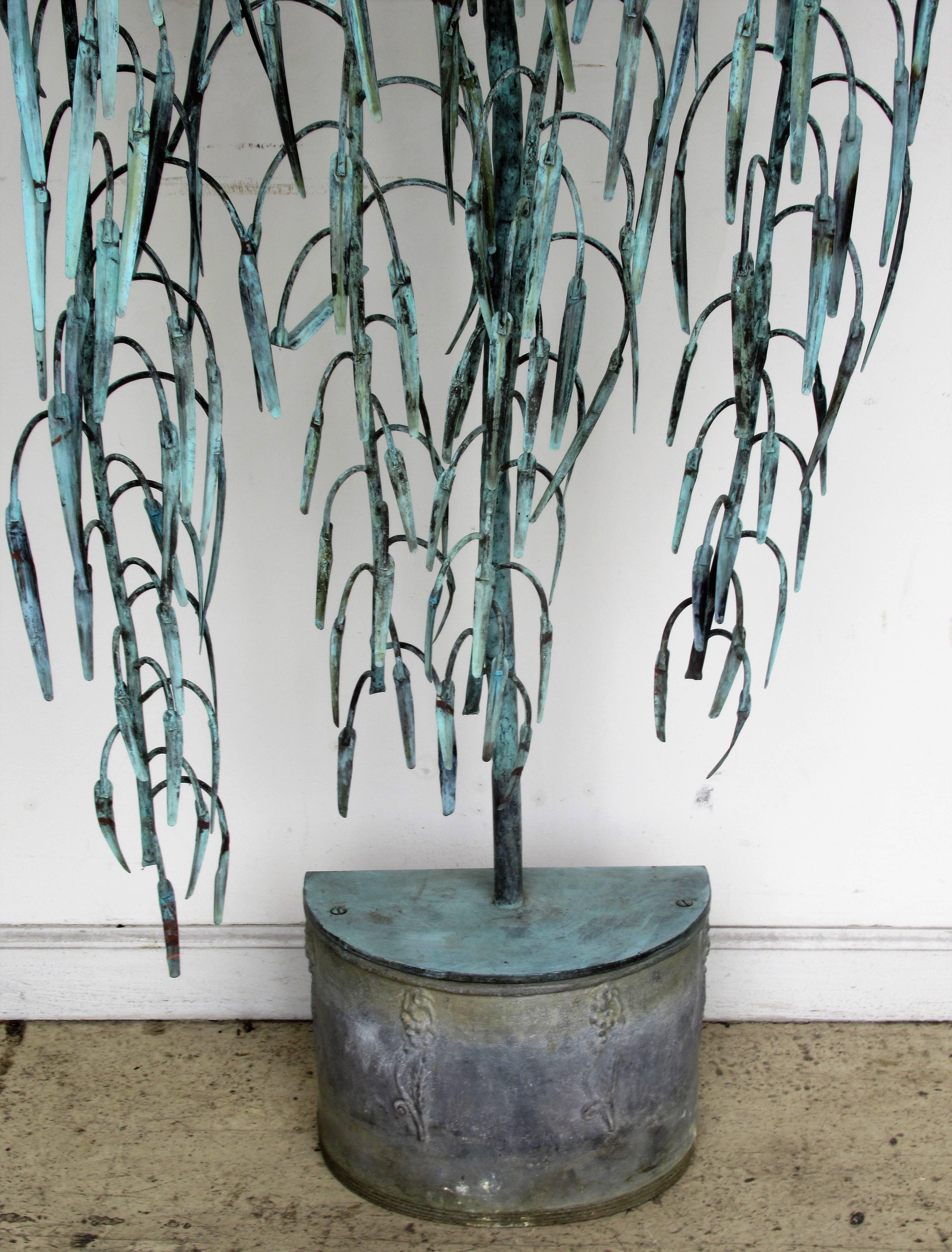 A copper, bronze and lead weeping willow garden fountain with the most beautifully aged old surface and rich verdigris patina from many decades of outdoor use. Circa 1920-1930. A very unique and rare item.