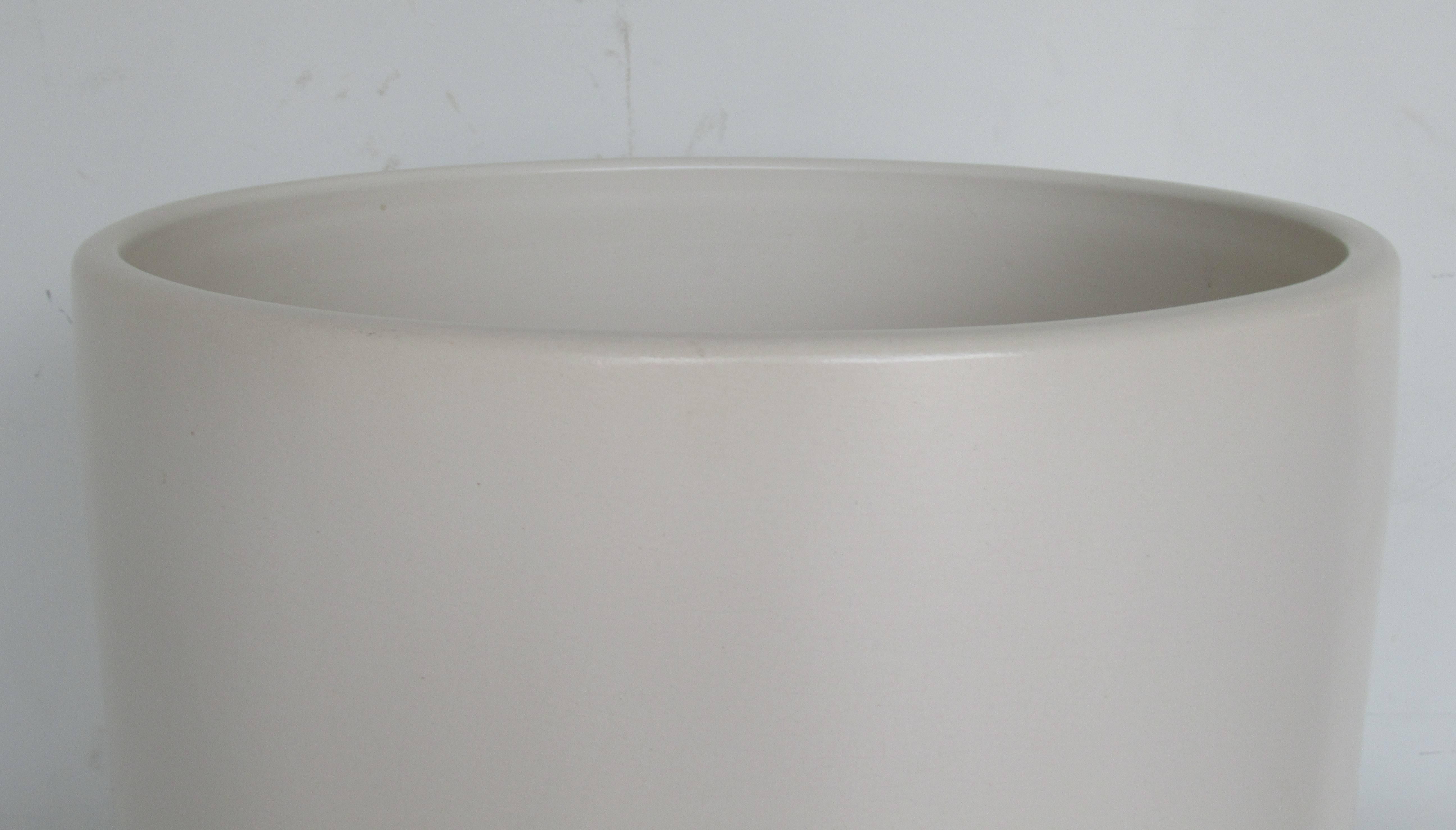 Very large and heavy cylindrical floor planter in white satin glaze. Minimalist design with no lip, no overhang and no drainage holes. Signed on inside bottom Architectural Pottery - Made in U.S.A and signed on outside bottom U.S.A., circa 1960, Los