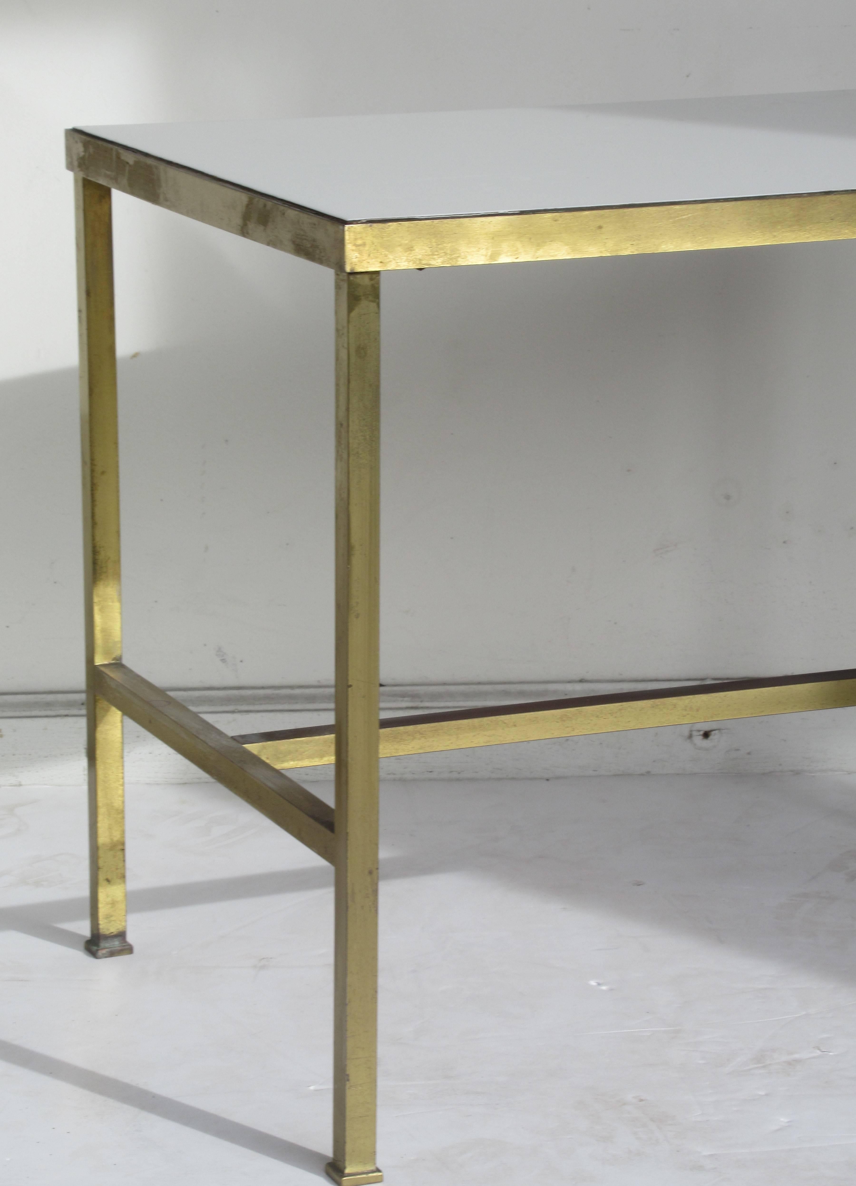 A sleek minimalist designed bronze brass table with inset white vitrolite top. Very fine quality construction. Beautiful. Harvey Probber attributed / Circa 1950 - 1960
