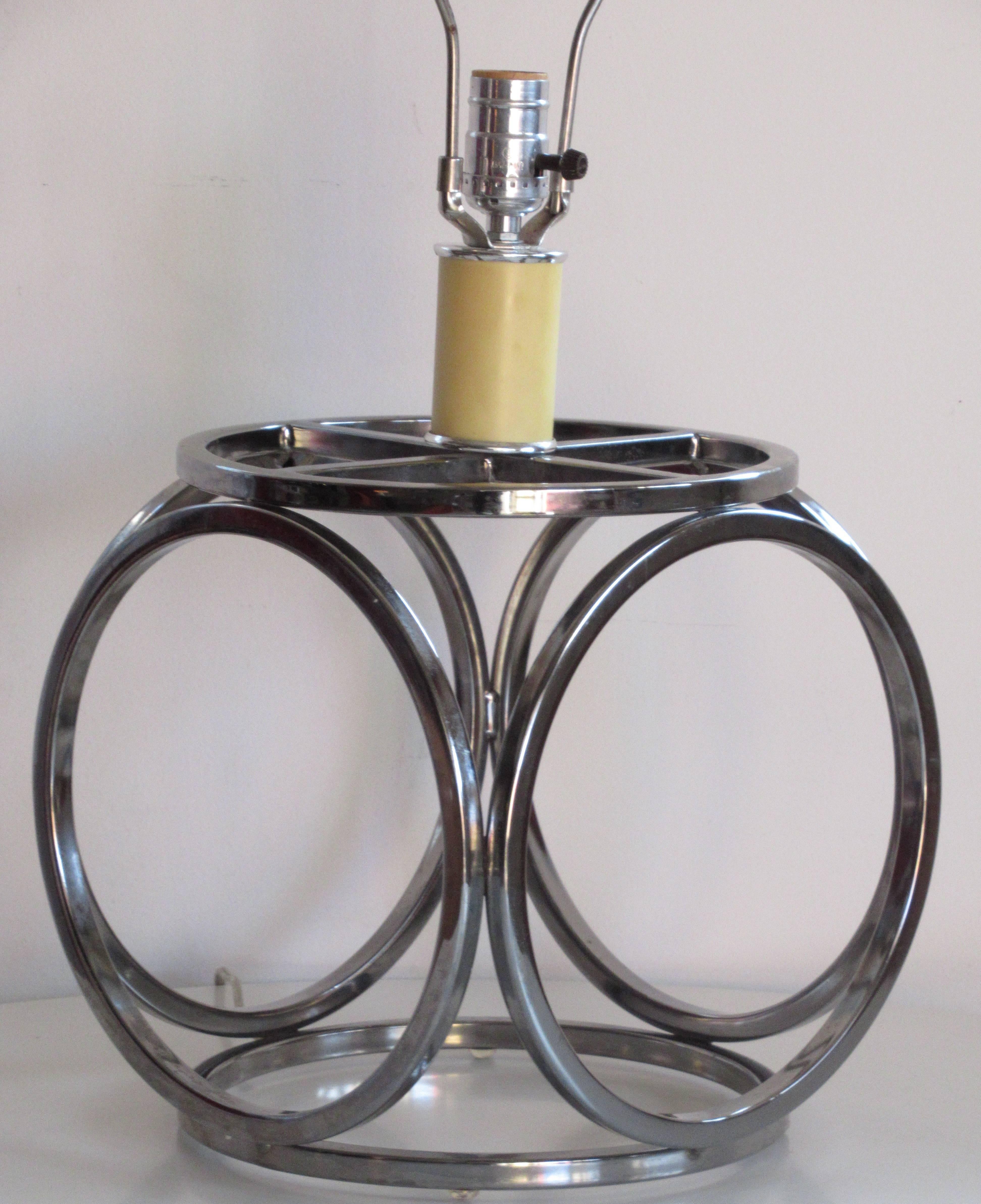A chrome table lamp with an op art geodesic design of six joined circles, circa 1970. A good quality great looking lamp.
