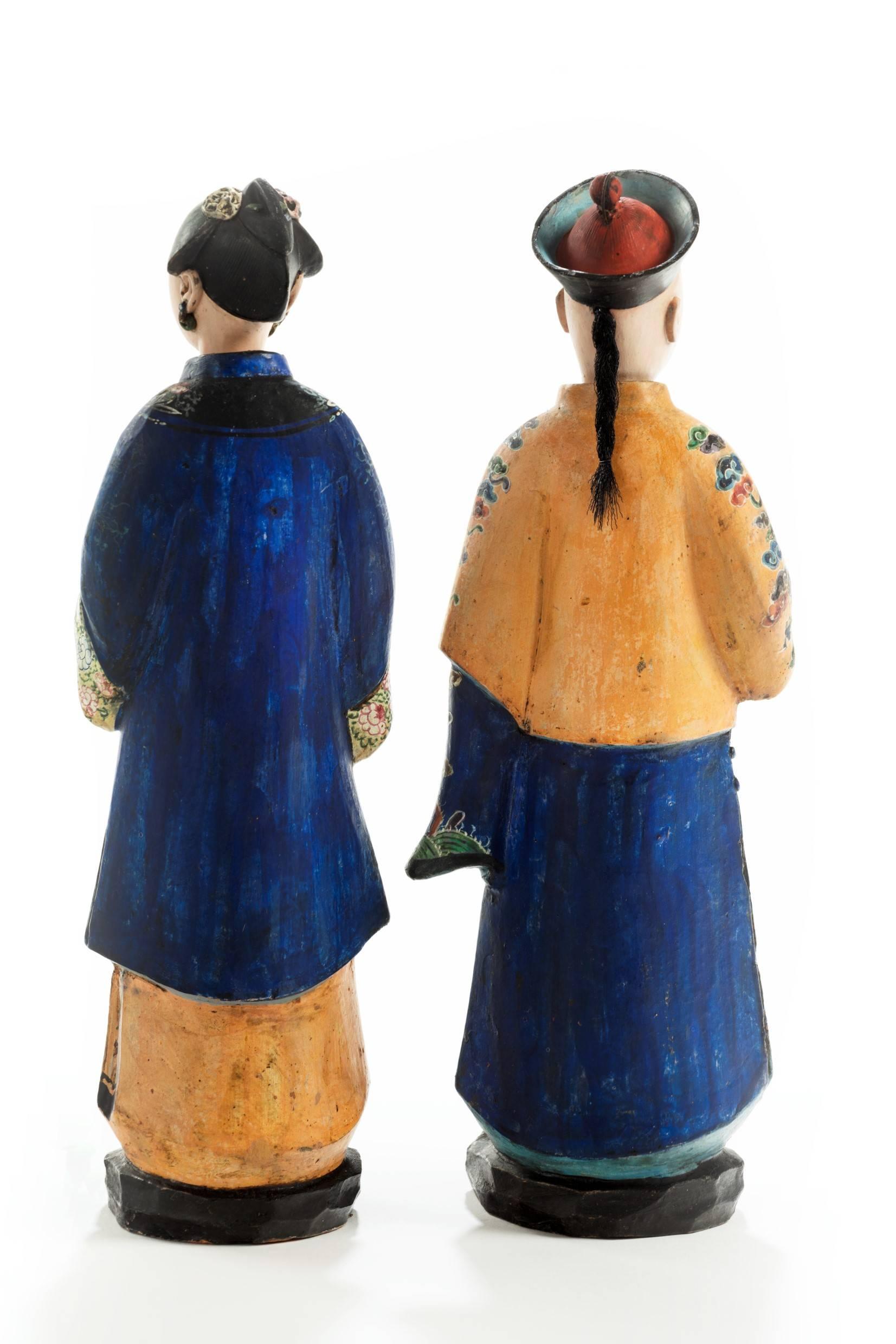 Delightful pair of Chinese terracotta nodding figures beautifully decorated and in wonderful condition. Depicting a courtier and his wife. 
Made for the European export market.