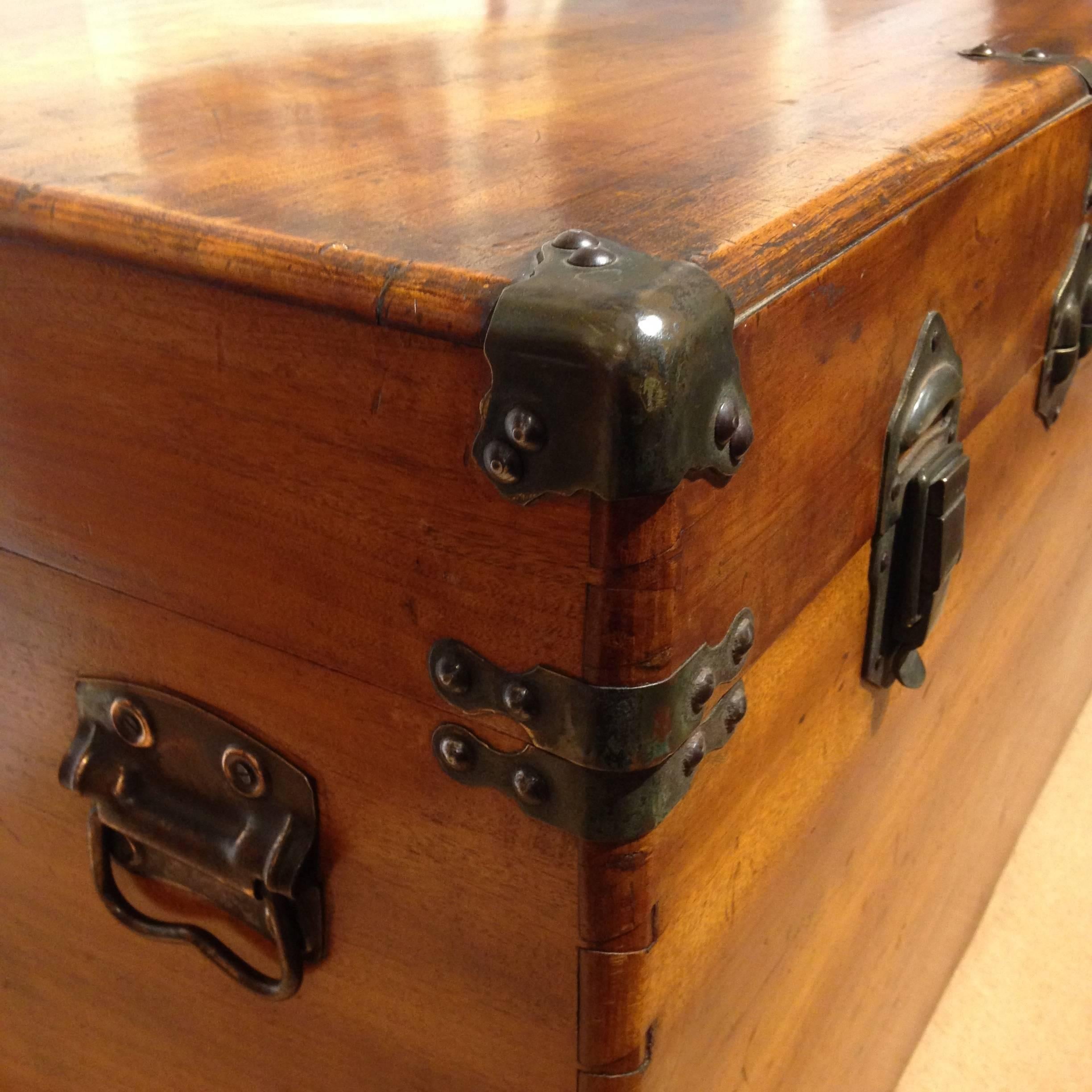 Made for the Chinese export market, this superb, well proportioned camphor wood trunk would make an ideal coffee table in today's world. Brass bound and with metal carrying handles which were a later addition. Ordinarily these trunks were packing