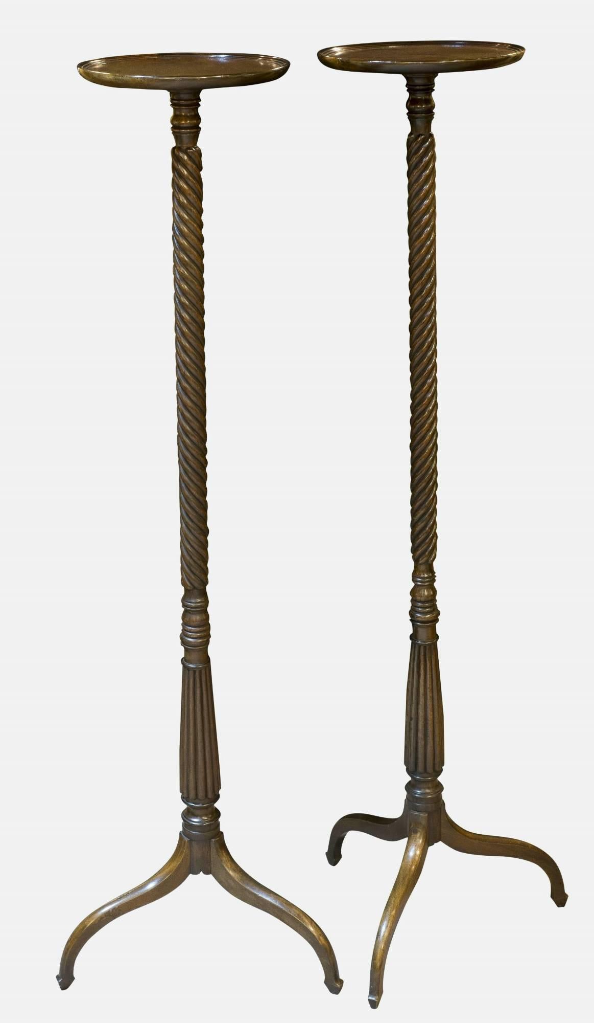 A very elegant pair of Georgian mahogany torchere stands, circa 1805.