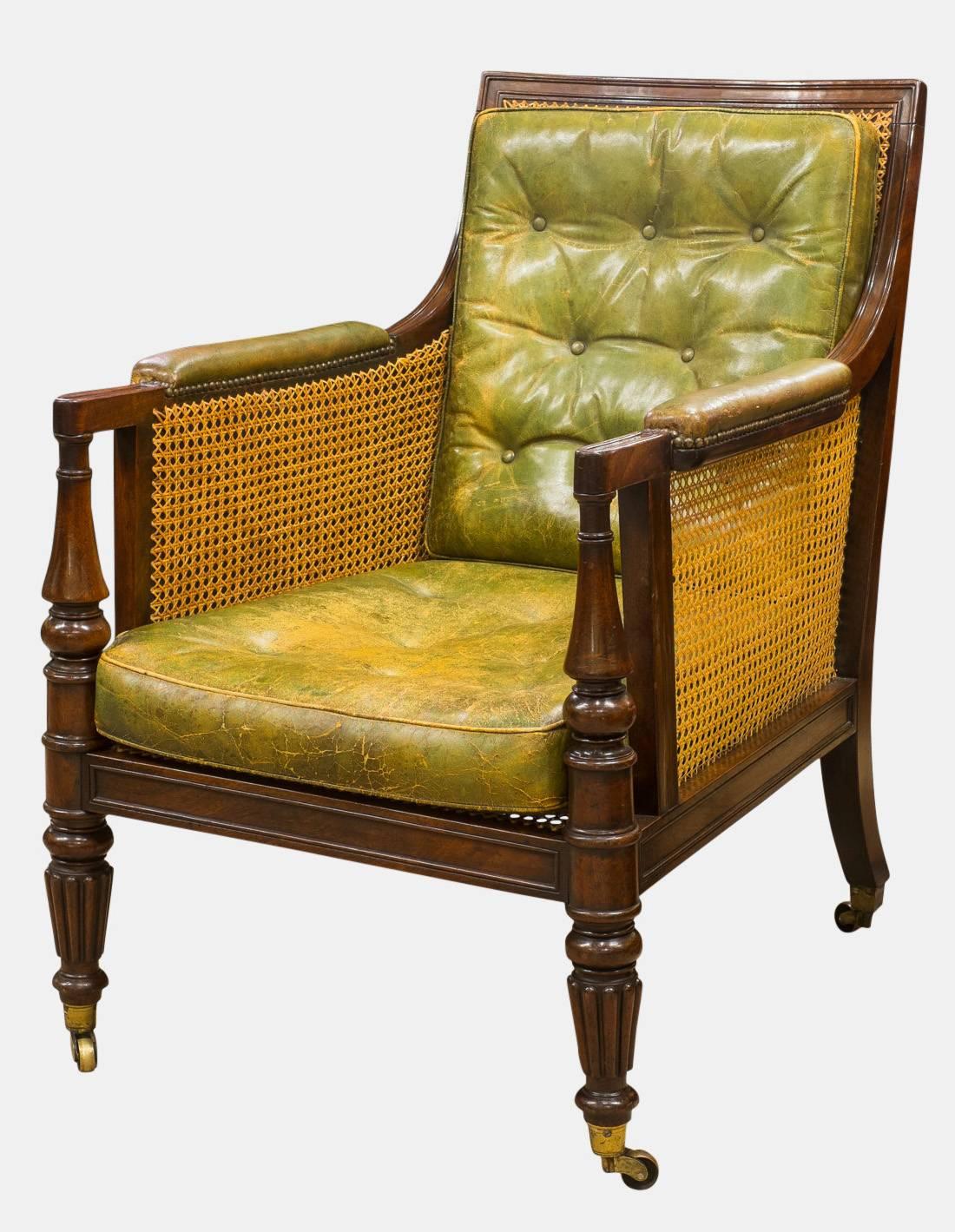 A superb Regency mahogany library Bergère chair, attributed to Gillows. With paneled, beaded framework, reeded front legs and original castors stamped B.S & P. Patent, chair maker stamp M.B., circa 1815.  