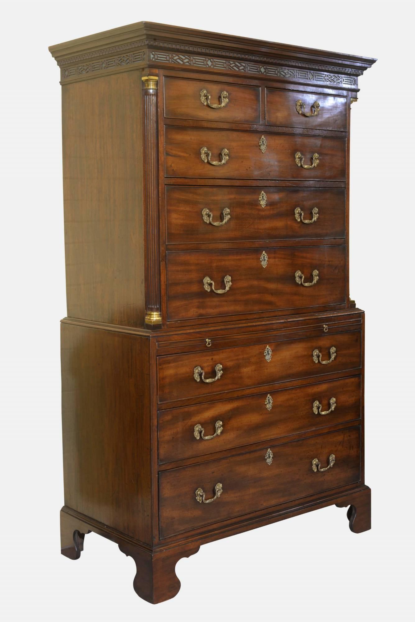 A simply beautiful early George III mahogany chest on chest with slide of fine quality and colour. Dentil cornice and fret work frieze above quarter column. Corners with gilt cappings, cast gilt rococo handles and oak lined drawers. Restored bracket