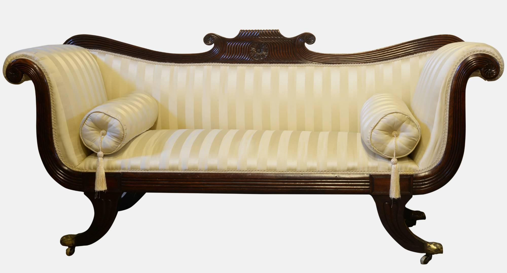 A Regency mahogany scroll ended sofa on splayed feet,

circa 1820.

Measures: 86cm (33.9