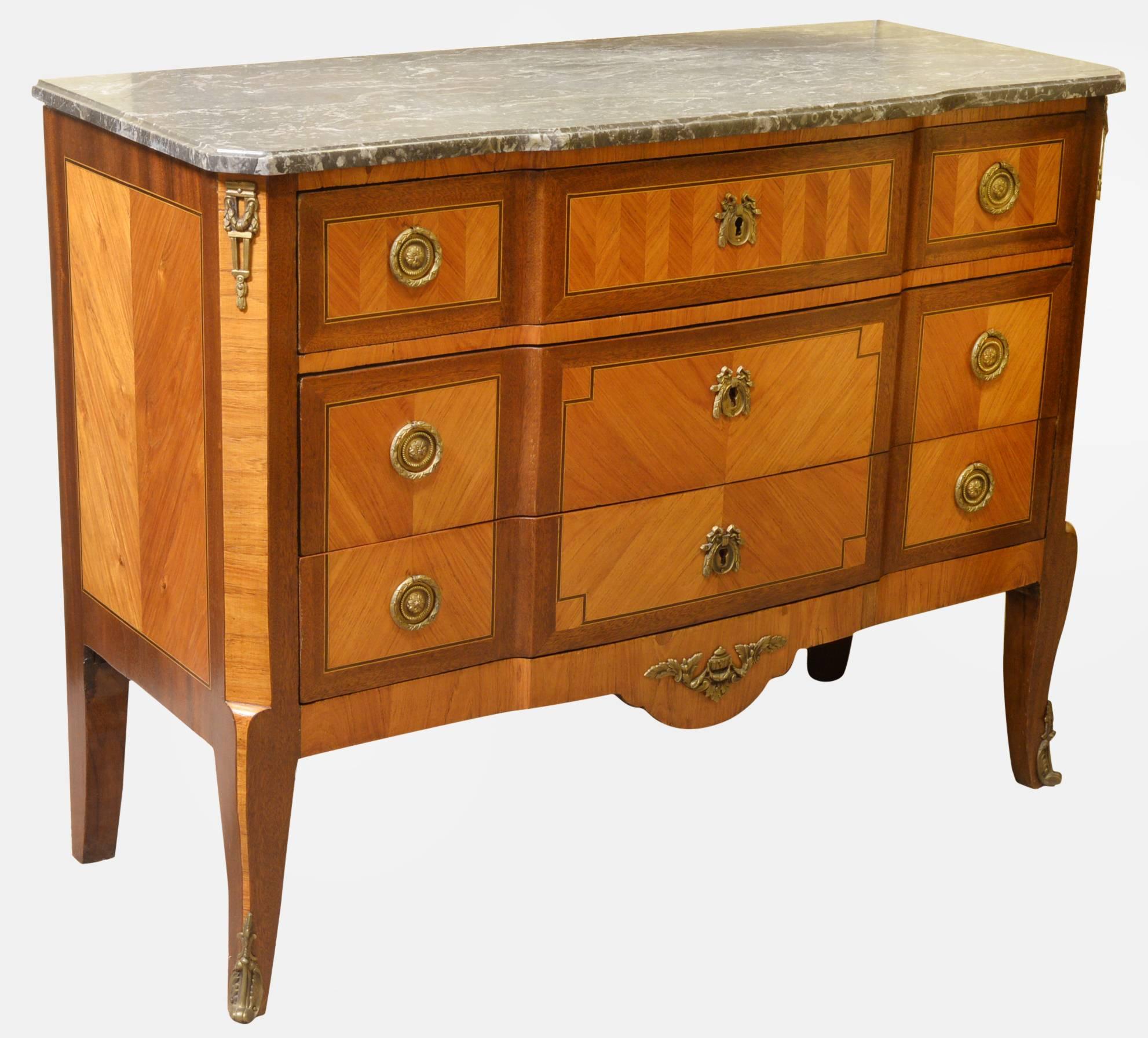 A French transitional style marble-topped commode on short cabriole legs with ormolu mounts.

circa 1900.
Measures:
83cm (32.7
