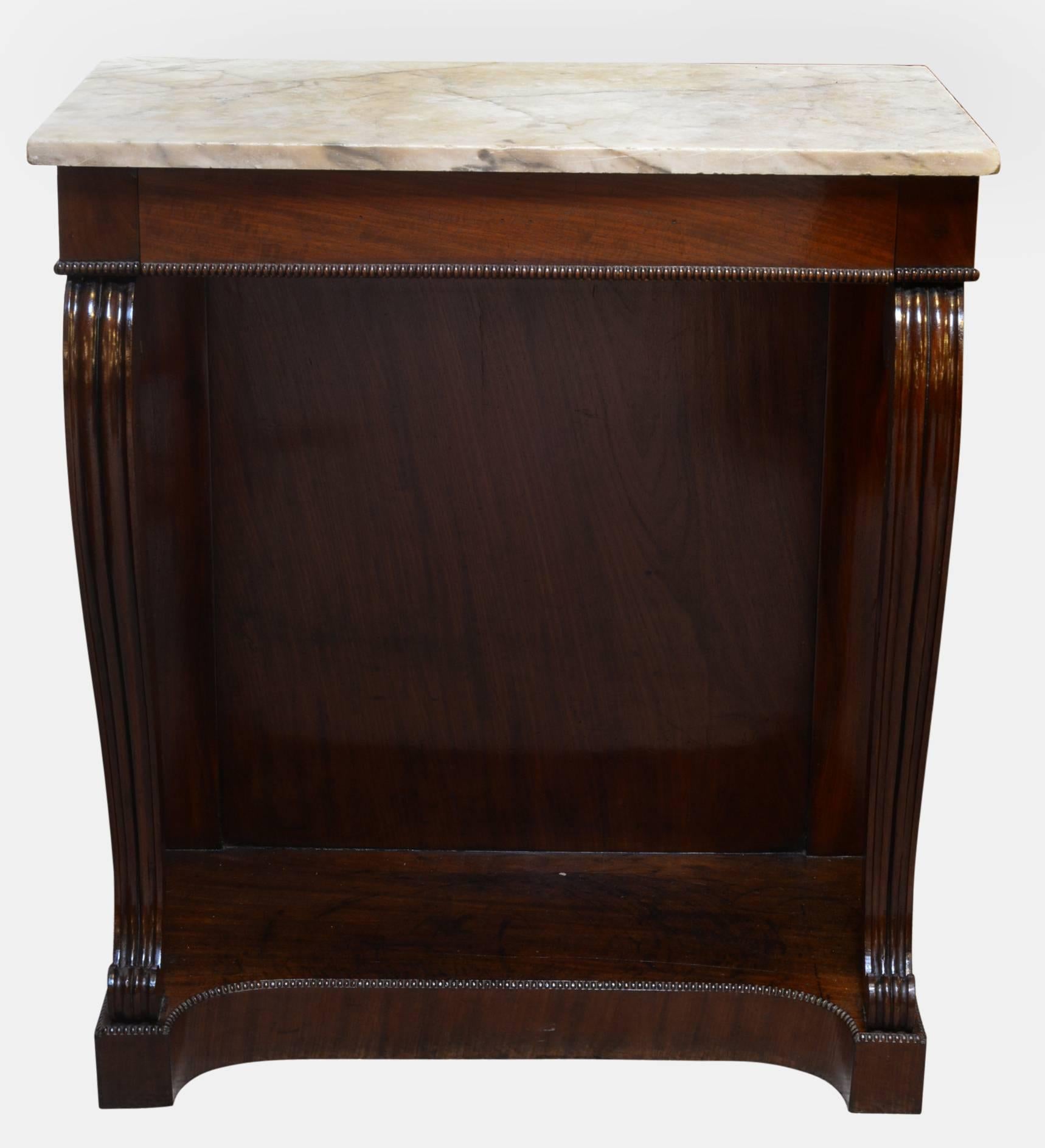 A Regency mahogany console table with marble top and frieze drawer. Supported by scrolling supports on plinth base,

circa 1820.

Measures: 88cm (34.6
