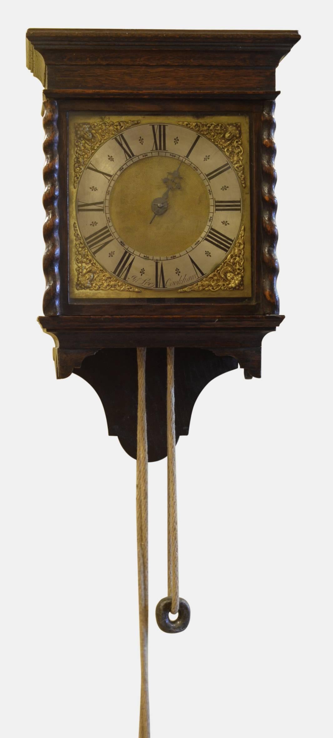 An early 18th century 'Stirrup & Spike' birdcage movement wall clock. Mounted in a later hooded wall clock case.

Signed by John Lee of Cookham, 

circa 1770.

Measures: 48 cm (18.9